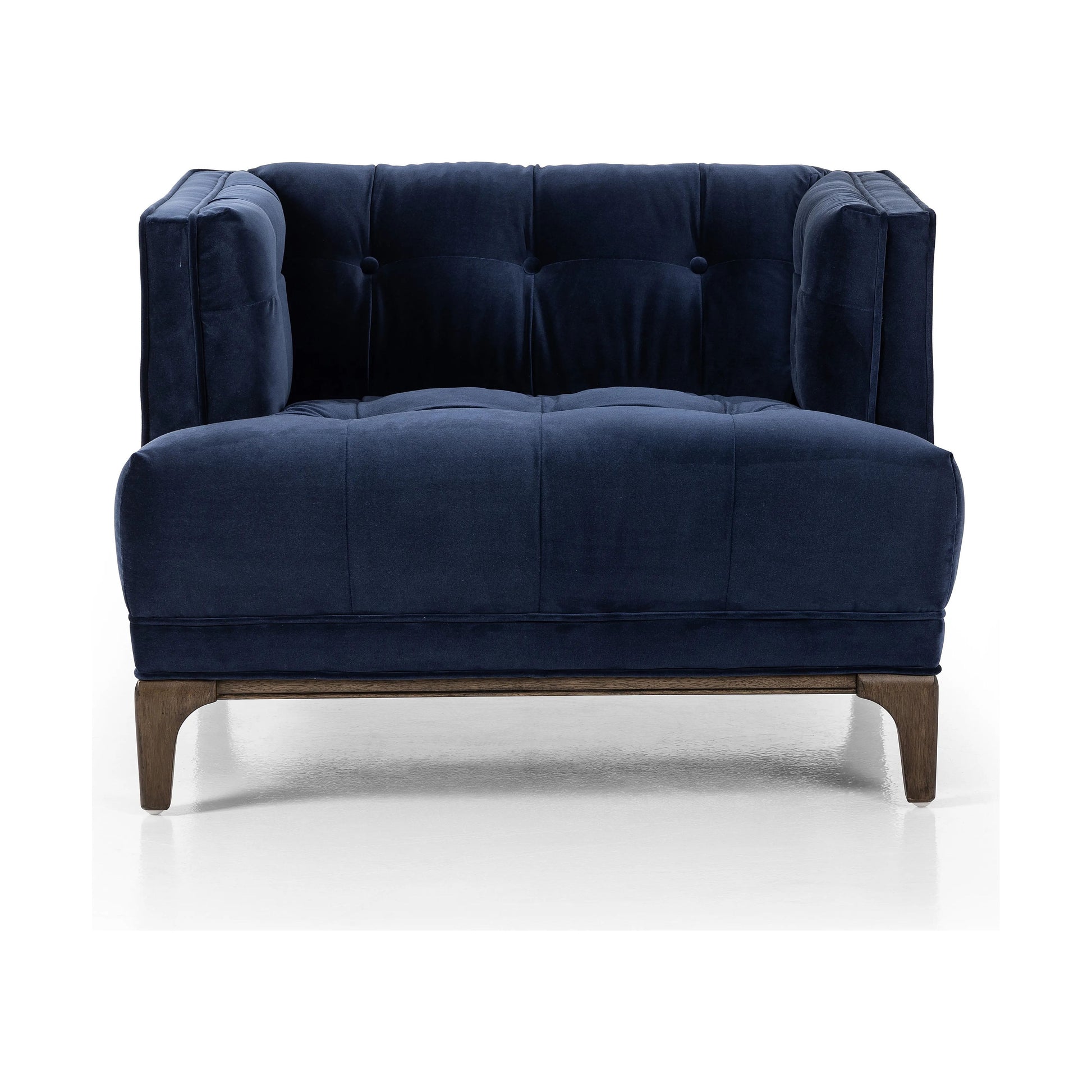 This low, tailored midcentury silhouette is upholstered in a velvety navy fabric, with dramatic blind tufting for texture.Collection: Kensingto Amethyst Home provides interior design, new home construction design consulting, vintage area rugs, and lighting in the Boston metro area.