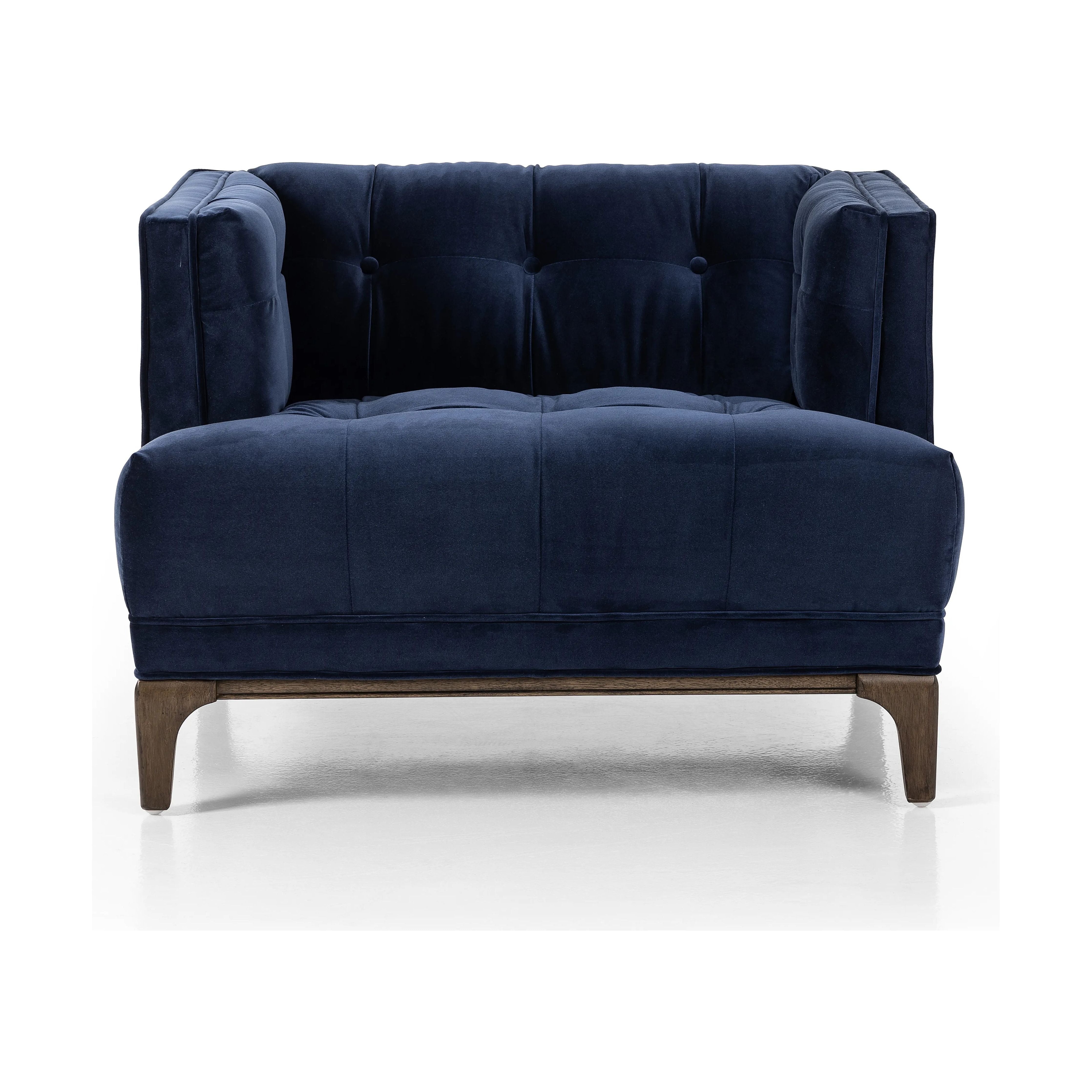 This low, tailored midcentury silhouette is upholstered in a velvety navy fabric, with dramatic blind tufting for texture.Collection: Kensingto Amethyst Home provides interior design, new home construction design consulting, vintage area rugs, and lighting in the Boston metro area.