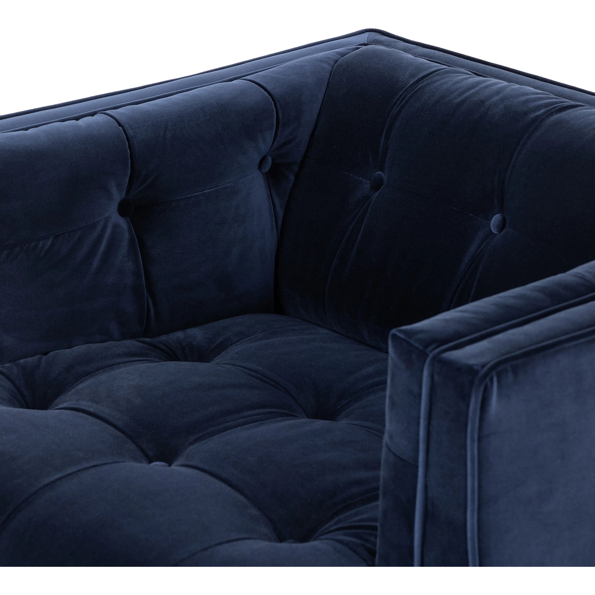 This low, tailored midcentury silhouette is upholstered in a velvety navy fabric, with dramatic blind tufting for texture.Collection: Kensingto Amethyst Home provides interior design, new home construction design consulting, vintage area rugs, and lighting in the Houston metro area.