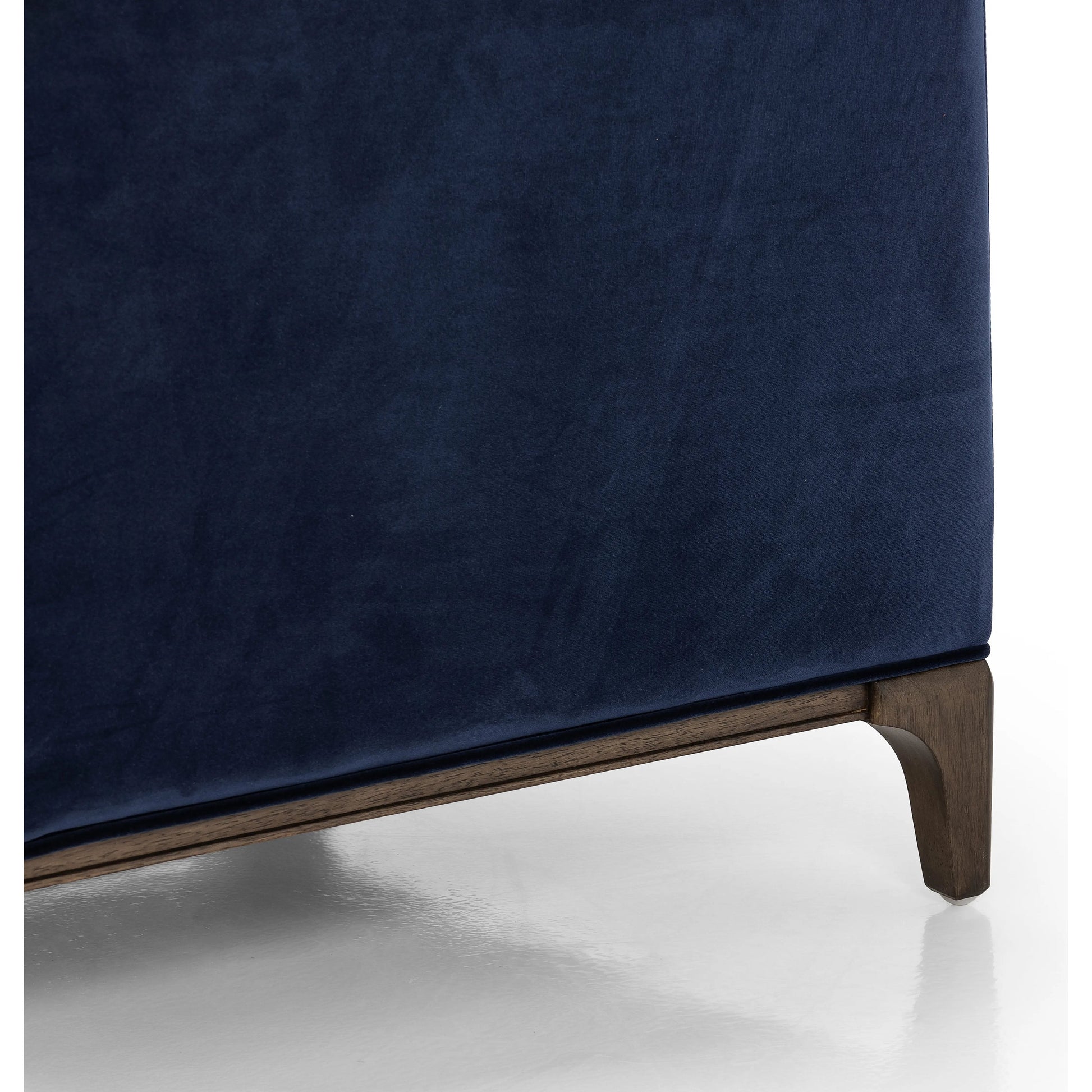 This low, tailored midcentury silhouette is upholstered in a velvety navy fabric, with dramatic blind tufting for texture.Collection: Kensingto Amethyst Home provides interior design, new home construction design consulting, vintage area rugs, and lighting in the Monterey metro area.