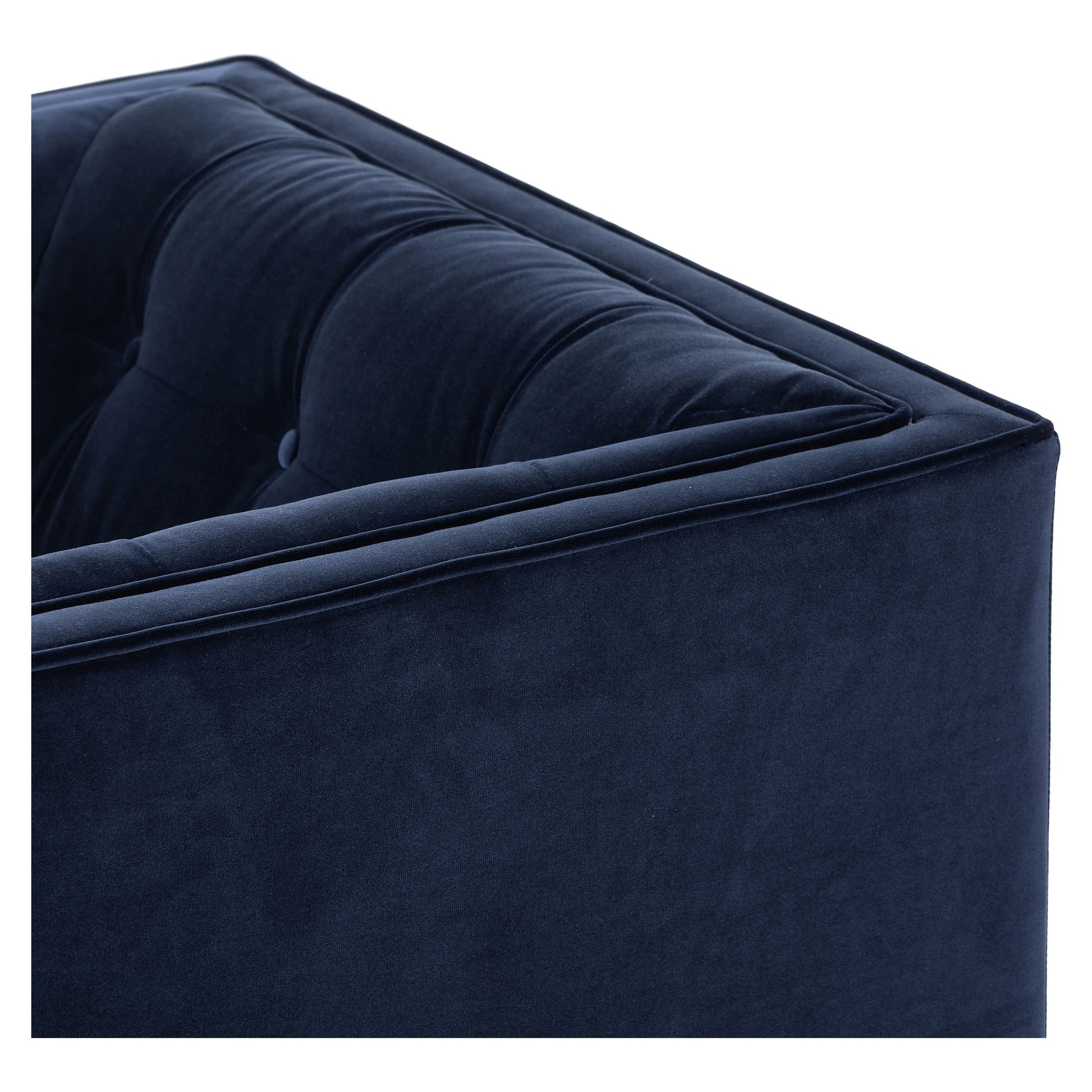 This low, tailored midcentury silhouette is upholstered in a velvety navy fabric, with dramatic blind tufting for texture.Collection: Kensingto Amethyst Home provides interior design, new home construction design consulting, vintage area rugs, and lighting in the Tampa metro area.