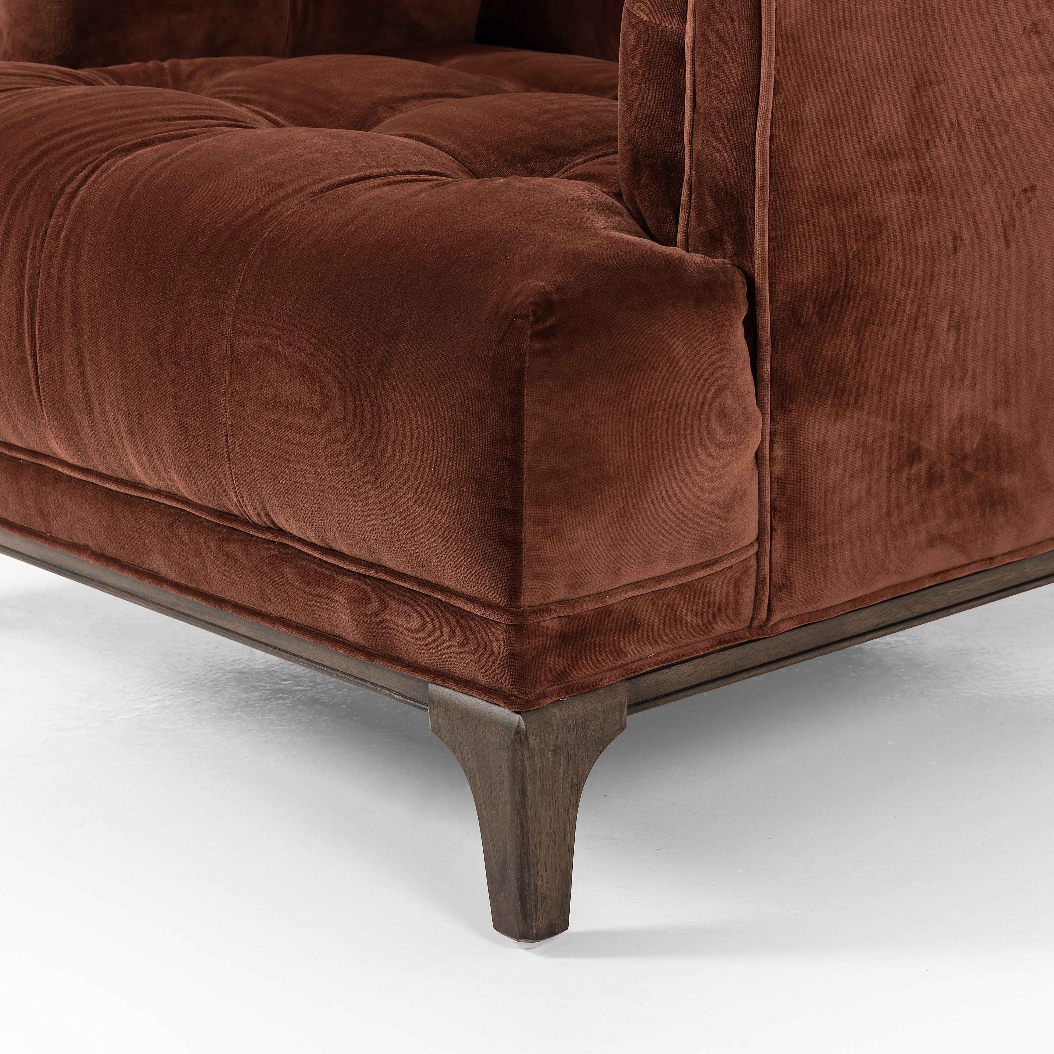 This low, tailored midcentury silhouette is upholstered in a velvety auburn fabric, with dramatic blind tufting for texture. Amethyst Home provides interior design, new home construction design consulting, vintage area rugs, and lighting in the Salt Lake City metro area.