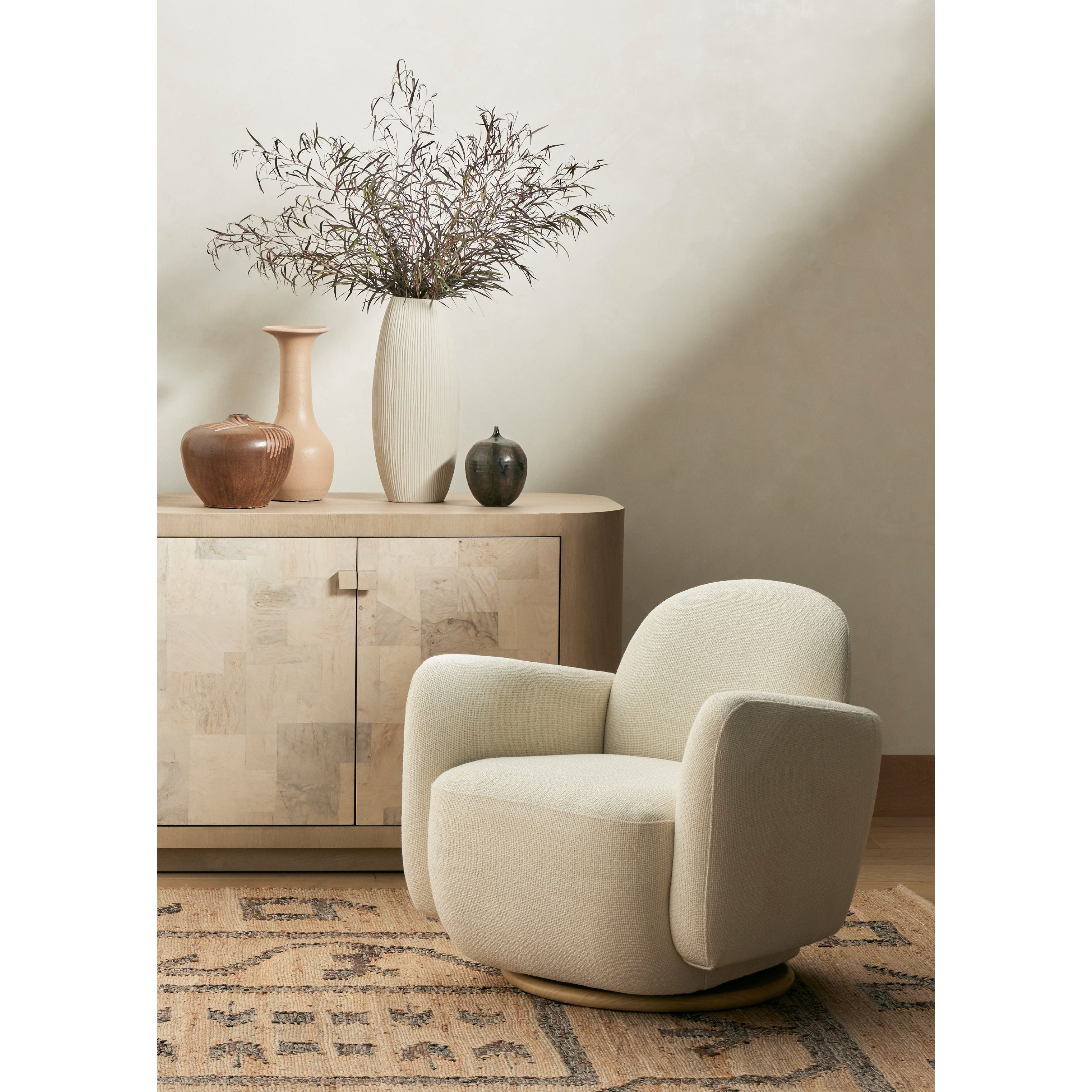 With the soft volume and exaggerated curves, the Enya Gibson White Swivel Chair is upholstered with high-performance fabric atop a plinth-style swivel base. Performance fabrics are specially created to withstand spills, stains, high traffic, and wear, ensuring long-term comfort and unmatched durability. Amethyst Home provides interior design services, furniture, rugs, and lighting in the Charlotte metro area.