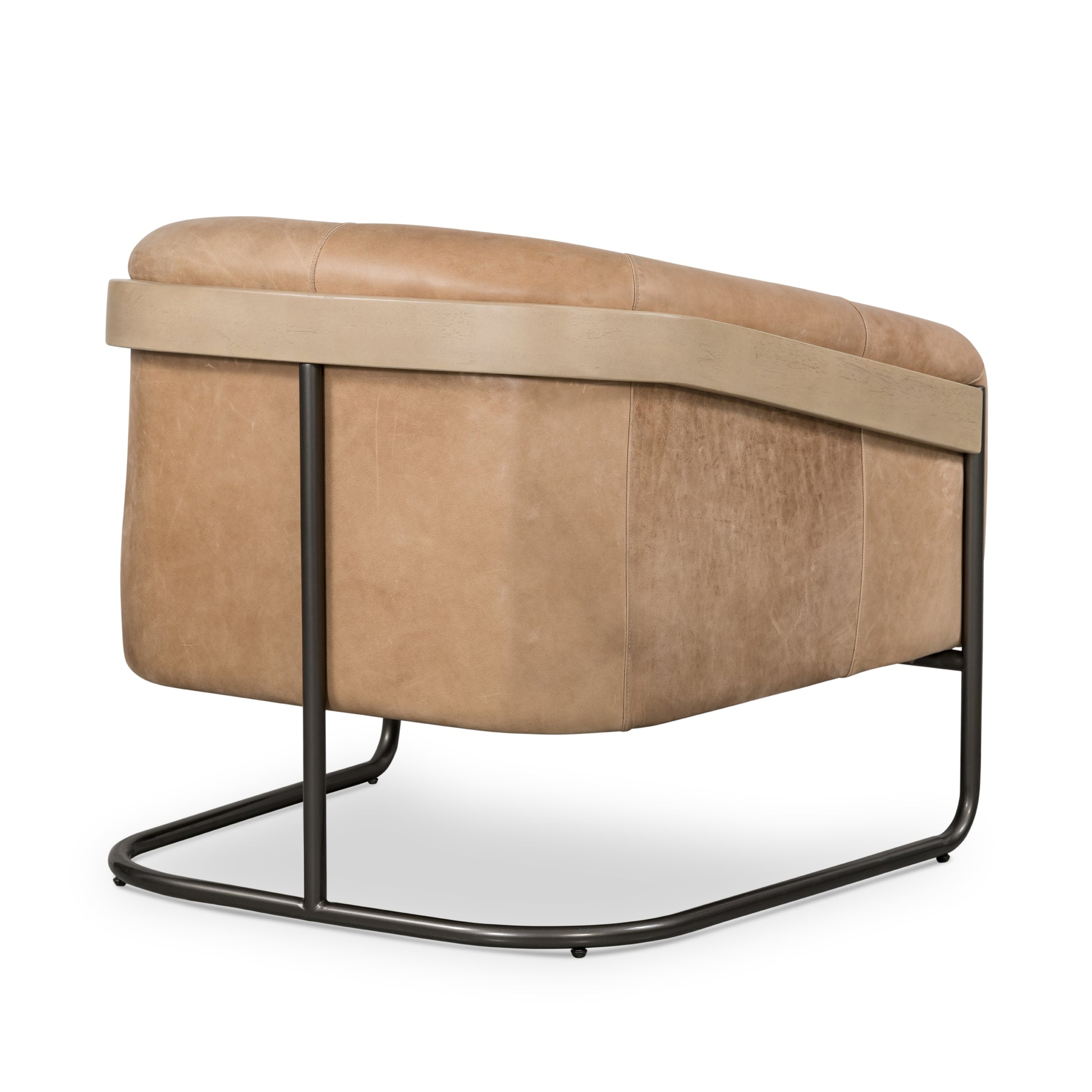 Deco-driven elegance. A fresh take on the traditional cigar chair, impeccably tailored tan top-grain leather forms a curvy U shape, with solid parawood detailing adding interest to gunmetal-finished iron framing. Amethyst Home provides interior design, new construction, custom furniture, and area rugs in the Calabasas metro area.
