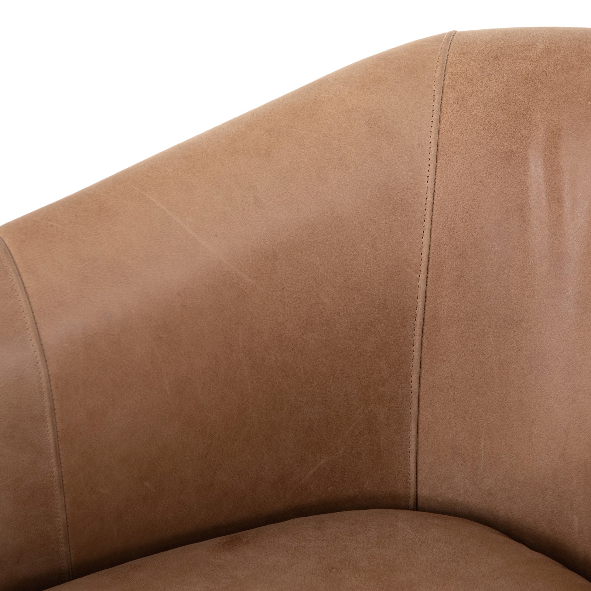 Deco-driven elegance. A fresh take on the traditional cigar chair, impeccably tailored tan top-grain leather forms a curvy U shape, with solid parawood detailing adding interest to gunmetal-finished iron framing. Amethyst Home provides interior design, new construction, custom furniture, and area rugs in the Kansas City metro area.