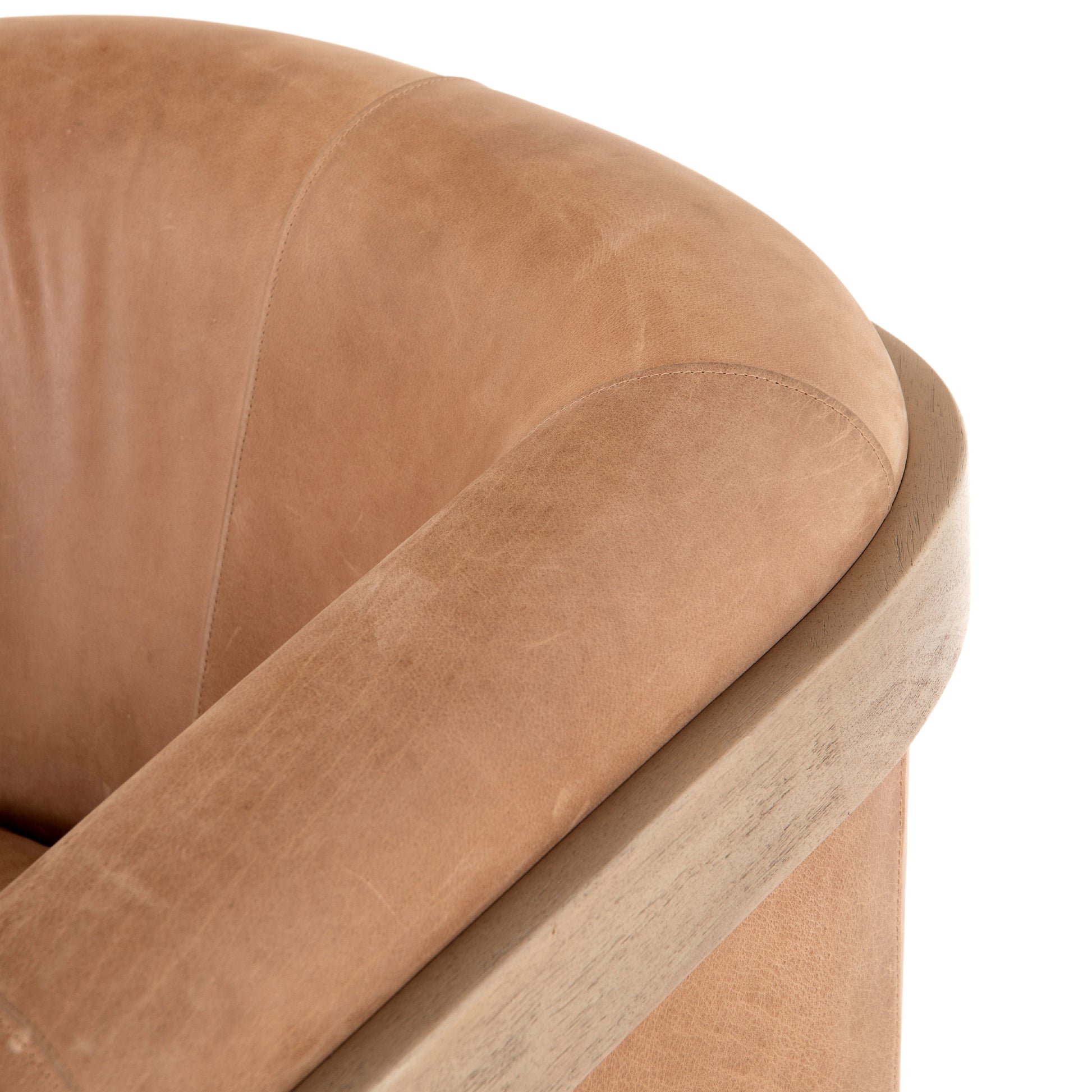 Deco-driven elegance. A fresh take on the traditional cigar chair, impeccably tailored tan top-grain leather forms a curvy U shape, with solid parawood detailing adding interest to gunmetal-finished iron framing. Amethyst Home provides interior design, new construction, custom furniture, and area rugs in the Scottsdale metro area.