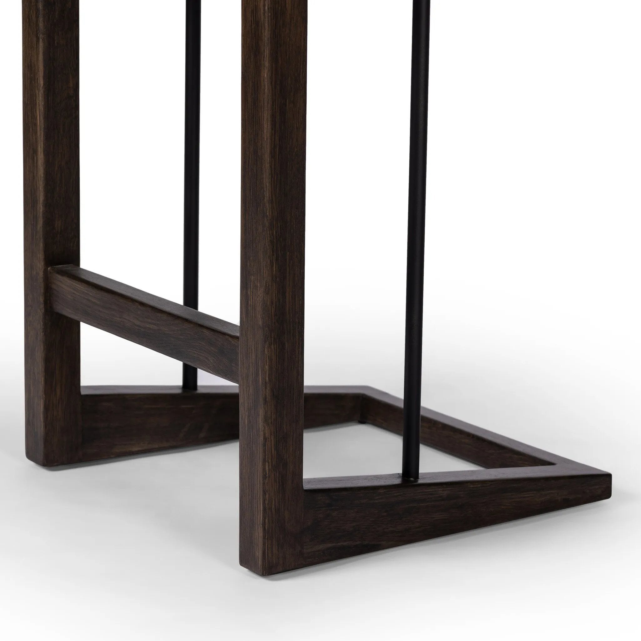 Featuring Finn Sienna Brown Oak Counter Stool by Four Hands at Amethyst Home. A stunner from every angle, this architecturally inspired stool features an angular base crafted from solid oak with two iron rods for added support and visual interest. Seat is upholstered in a linen/cotton/poly blend performance fabric with subtle texture throughout. Performa. Amethyst Home provides interior design, new home construction design consulting, vintage area rugs, and lighting in the Laguna Beach metro area.