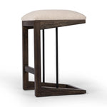 Featuring Finn Sienna Brown Oak Counter Stool by Four Hands at Amethyst Home. A stunner from every angle, this architecturally inspired stool features an angular base crafted from solid oak with two iron rods for added support and visual interest. Seat is upholstered in a linen/cotton/poly blend performance fabric with subtle texture throughout. Performance . Amethyst Home provides interior design, new home construction design consulting, vintage area rugs, and lighting in the Portland metro area.