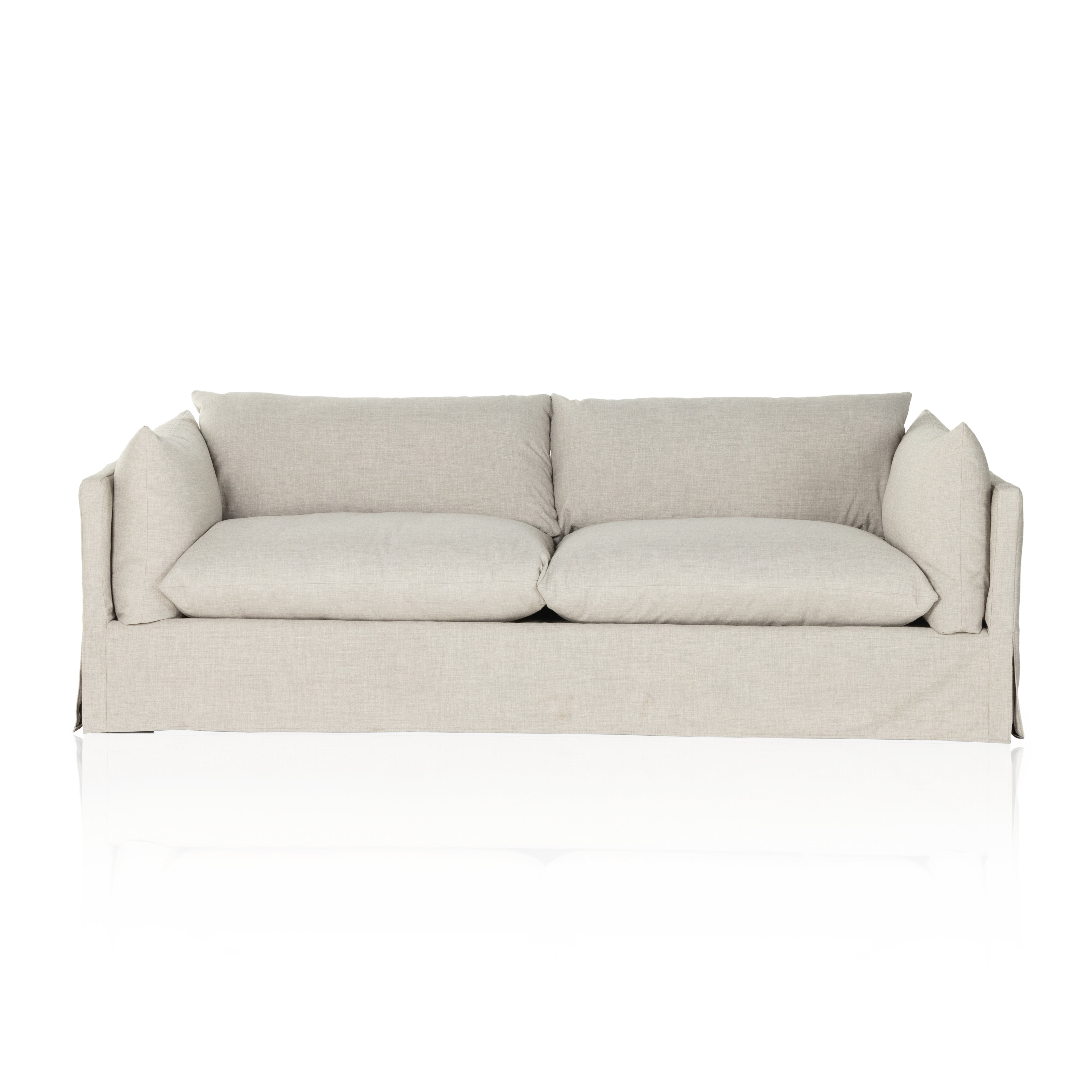 A slipcovered sofa made for modern living. Shelter arms and big, pillow-inspired cushions are covered in a durable comfortable fabric prime for lounging. Performance fabrics are specially created to withstand spills, stains, high traffic and wear, ensuring long-term comfort and unmatched durability. Amethyst Home provides interior design, new construction, custom furniture, and area rugs in the Charlotte metro area.