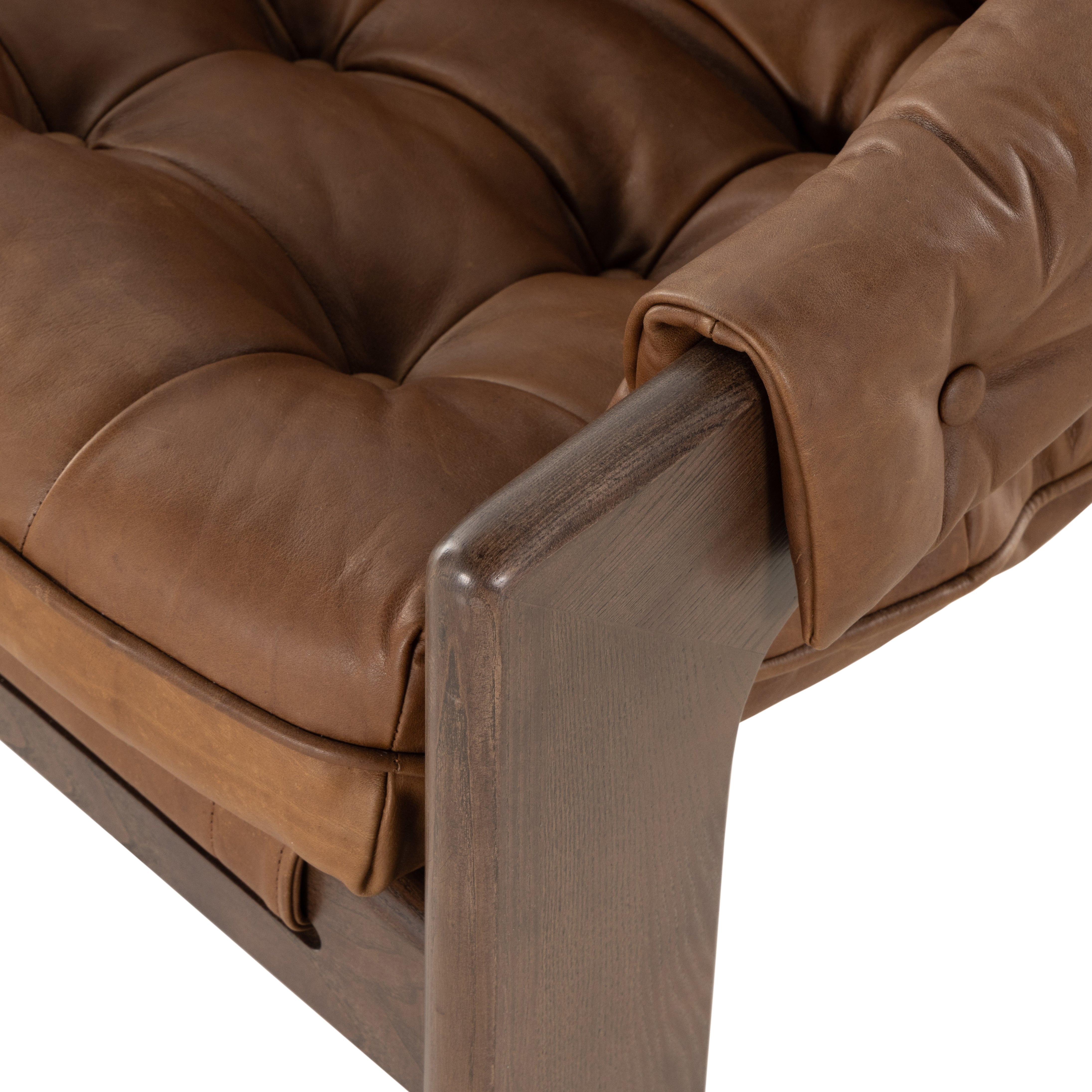 Featuring Halston Heirloom Sienna Chair by Four Hands at Amethyst Home. A Seventies-era style inspired by a flea market find, a dramatically tufted sling seat of black top-grain leather angles at the just-right pitch for total comfort, with wide, brown ash framing. Sourced from one of the oldest family-owned tanneries in Italy's Bassano del Grappa, heirlo. Amethyst Home provides interior design, new home construction design consulting, vintage area rugs, and lighting in the Los Angeles metro area.
