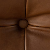 Featuring Halston Heirloom Sienna Chair by Four Hands at Amethyst Home. A Seventies-era style inspired by a flea market find, a dramatically tufted sling seat of black top-grain leather angles at the just-right pitch for total comfort, with wide, brown ash framing. Sourced from one of the oldest family-owned tanneries in Italy's Bassano del Grappa, heirloom lea. Amethyst Home provides interior design, new home construction design consulting, vintage area rugs, and lighting in the Miami metro area.