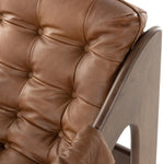 Featuring Halston Heirloom Sienna Chair by Four Hands at Amethyst Home. A Seventies-era style inspired by a flea market find, a dramatically tufted sling seat of black top-grain leather angles at the just-right pitch for total comfort, with wide, brown ash framing. Sourced from one of the oldest family-owned tanneries in Italy's Bassano del Grappa, heirloom. Amethyst Home provides interior design, new home construction design consulting, vintage area rugs, and lighting in the Park City metro area.