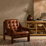 Featuring Halston Heirloom Sienna Chair by Four Hands at Amethyst Home. A Seventies-era style inspired by a flea market find, a dramatically tufted sling seat of black top-grain leather angles at the just-right pitch for total comfort, with wide, brown ash framing. Sourced from one of the oldest family-owned tanneries in Italy's Bassano del Grappa, heirloom . Amethyst Home provides interior design, new home construction design consulting, vintage area rugs, and lighting in the Portland metro area.