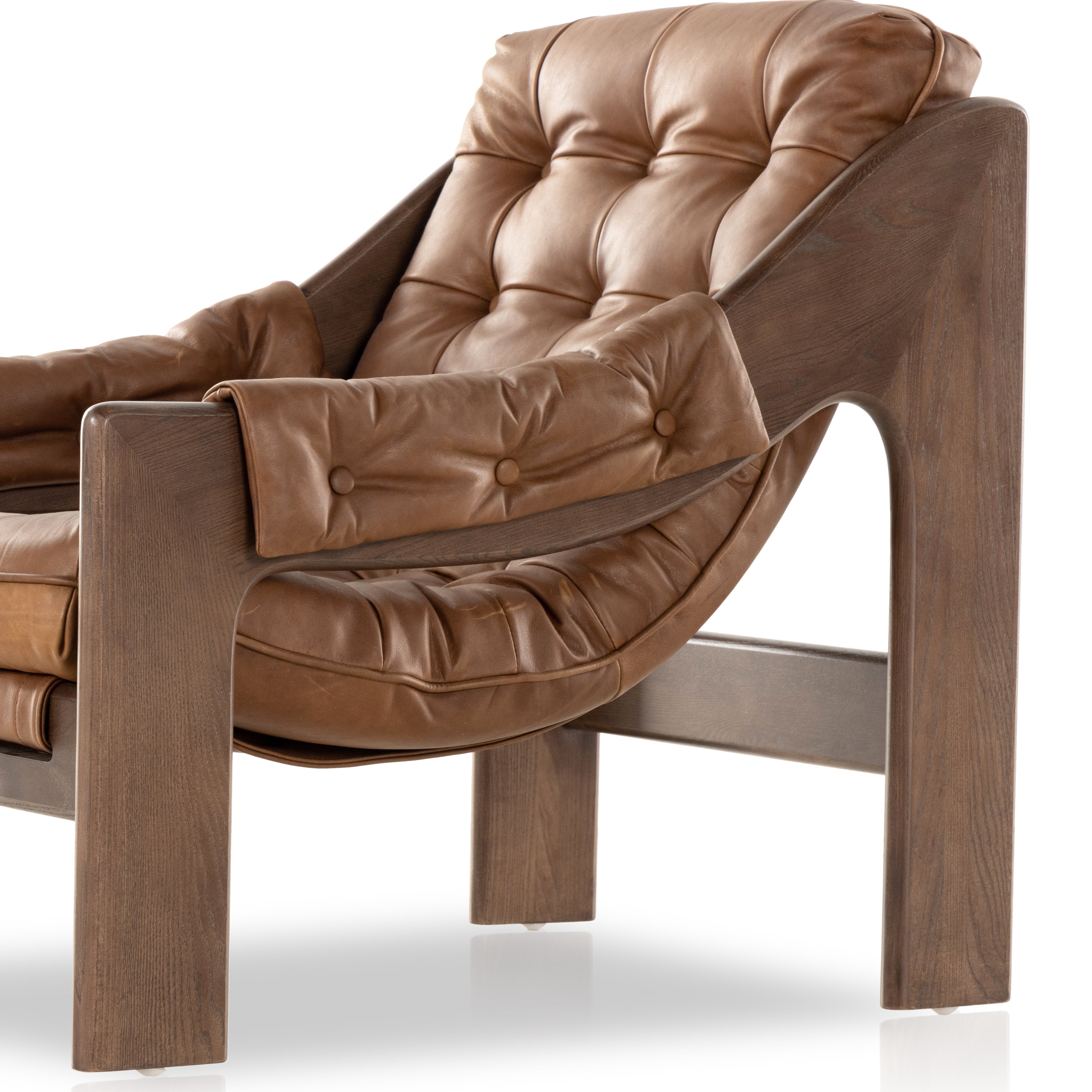 Featuring Halston Heirloom Sienna Chair by Four Hands at Amethyst Home. A Seventies-era style inspired by a flea market find, a dramatically tufted sling seat of black top-grain leather angles at the just-right pitch for total comfort, with wide, brown ash framing. Sourced from one of the oldest family-owned tanneries in Italy's Bassano del Grappa, hei. Amethyst Home provides interior design, new home construction design consulting, vintage area rugs, and lighting in the Salt Lake City metro area.