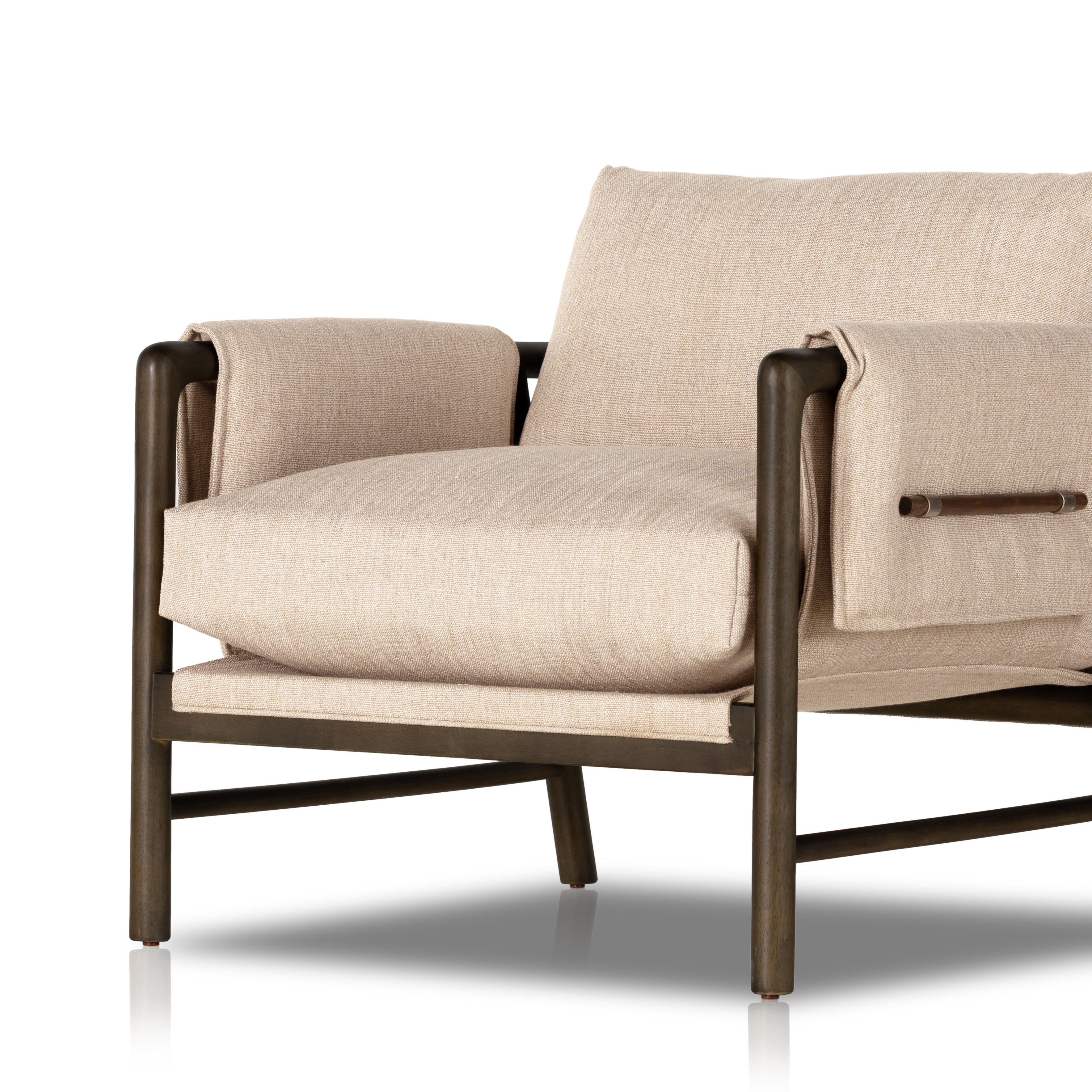 Details make the chair. With poly-blend performance fabric that wraps each arm, faux toggles add an element of interest to midcentury-inspired seating in a wheat hue, with softly sculpted parawood framing carrying out a beautiful neutral look. Amethyst Home provides interior design, new construction, custom furniture, and area rugs in the Alpharetta metro area.
