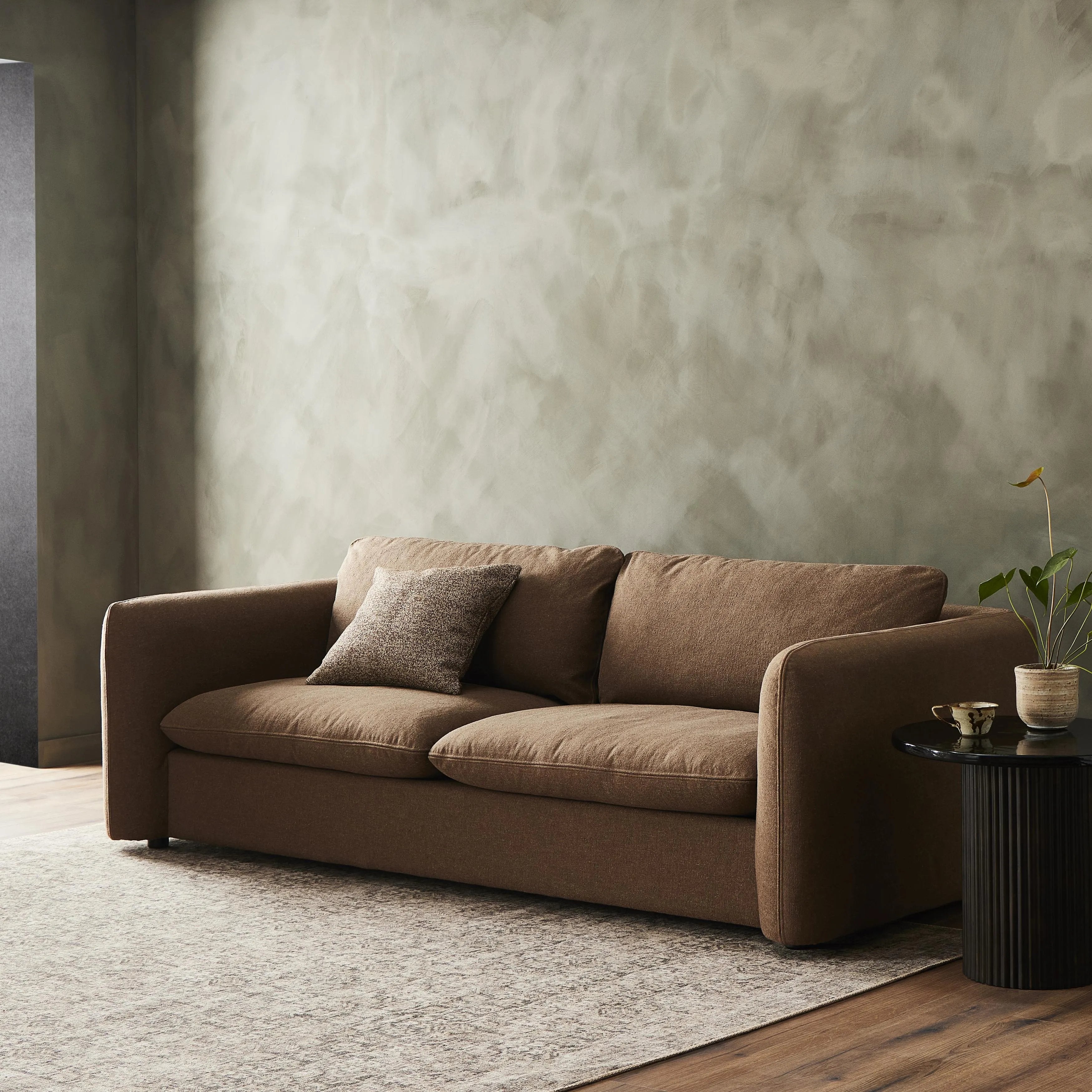 Inflated, pillow-inspired cushioning all around brings cozy comfort to the room. High-performance linen offers the best of both worlds on this plush and welcoming sofa.  Inflated arms, feather-fiber blend cushioning and a soft, durable linen fabric make this spacious sofa a smart solution for the comfort-driven living space.Collection: Kensingto Amethyst Home provides interior design, new home construction design consulting, vintage area rugs, and lighting in the Dallas metro area.