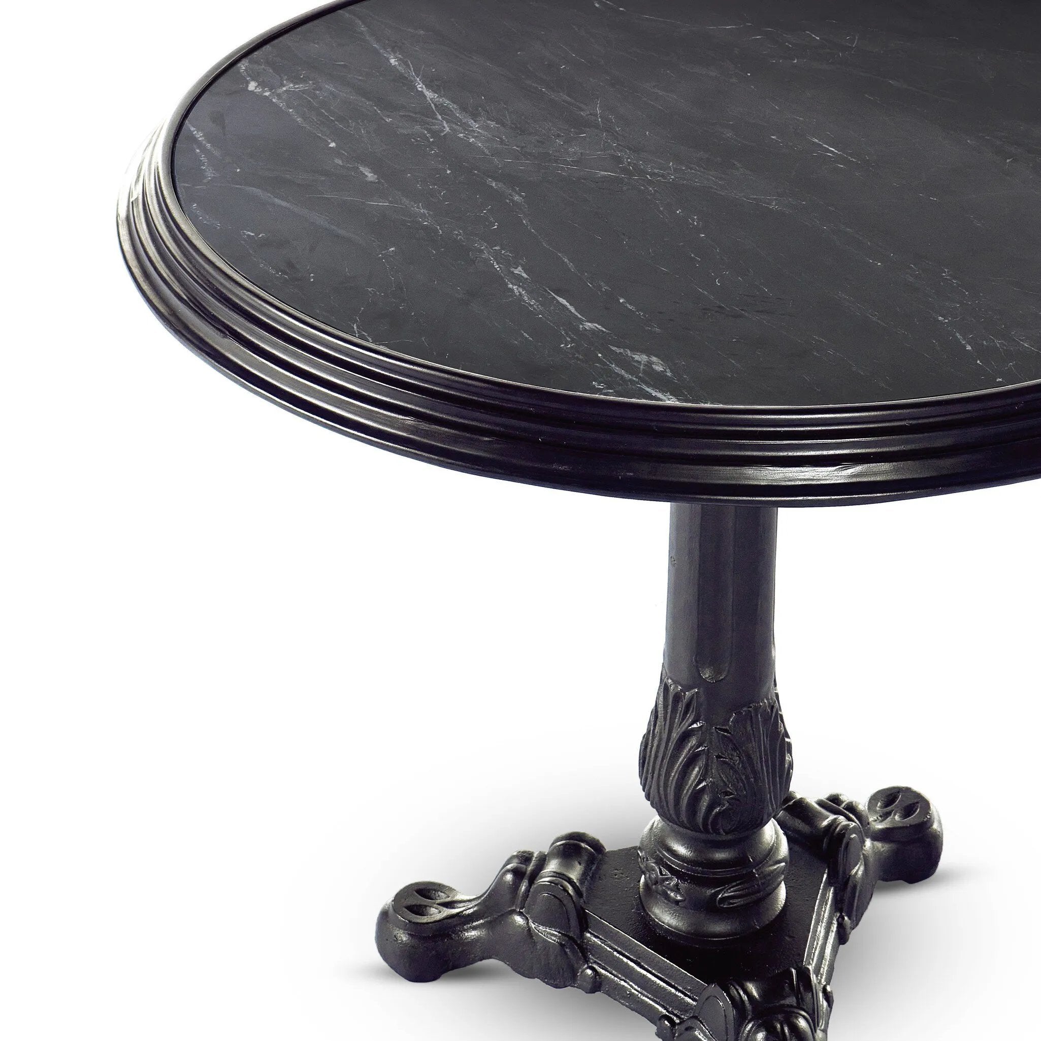 For a fresh take on classic Parisian styling, an ornate cast iron base is topped with black marble.Collection: Rockwel Amethyst Home provides interior design, new home construction design consulting, vintage area rugs, and lighting in the Omaha metro area.