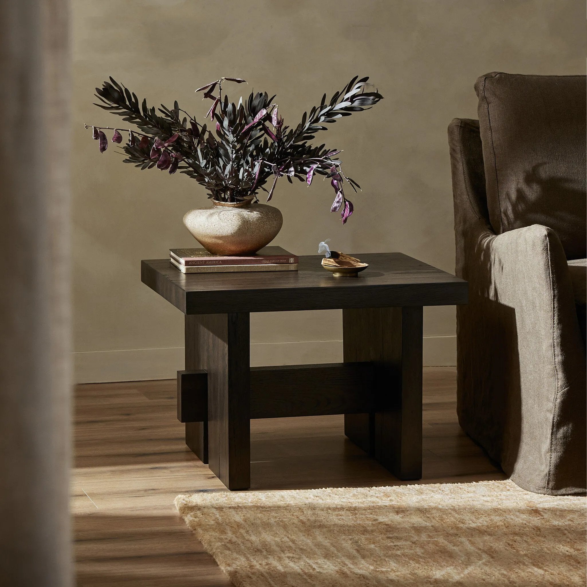 A versatile end table of smoked black oak features joint and connection construction for a design-forward look. Visible knots and graining add character.Collection: Haide Amethyst Home provides interior design, new home construction design consulting, vintage area rugs, and lighting in the Des Moines metro area.