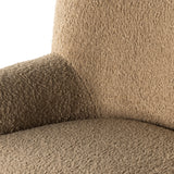 Simply classic. The Kadon Swivel Chair features a high wing back and pairs with softly rolled arms for a curvy look and supportive sit. Camel-colored shearling-upholstered seating tops a 360-degree swivel for total modernity. Amethyst Home provides interior design, new home construction design consulting, vintage area rugs, and lighting in the Dallas metro area.