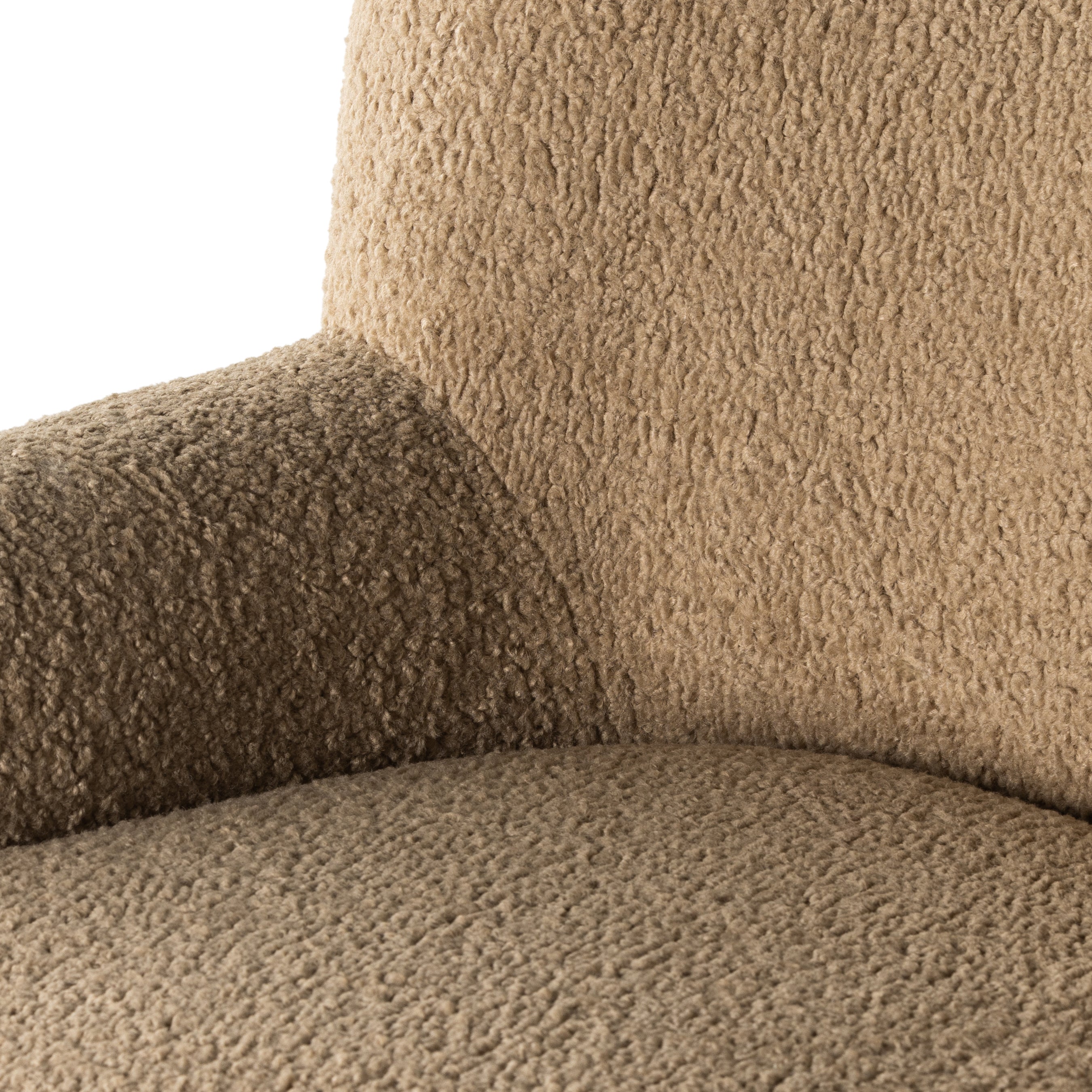 Simply classic. The Kadon Swivel Chair features a high wing back and pairs with softly rolled arms for a curvy look and supportive sit. Camel-colored shearling-upholstered seating tops a 360-degree swivel for total modernity. Amethyst Home provides interior design, new home construction design consulting, vintage area rugs, and lighting in the Dallas metro area.