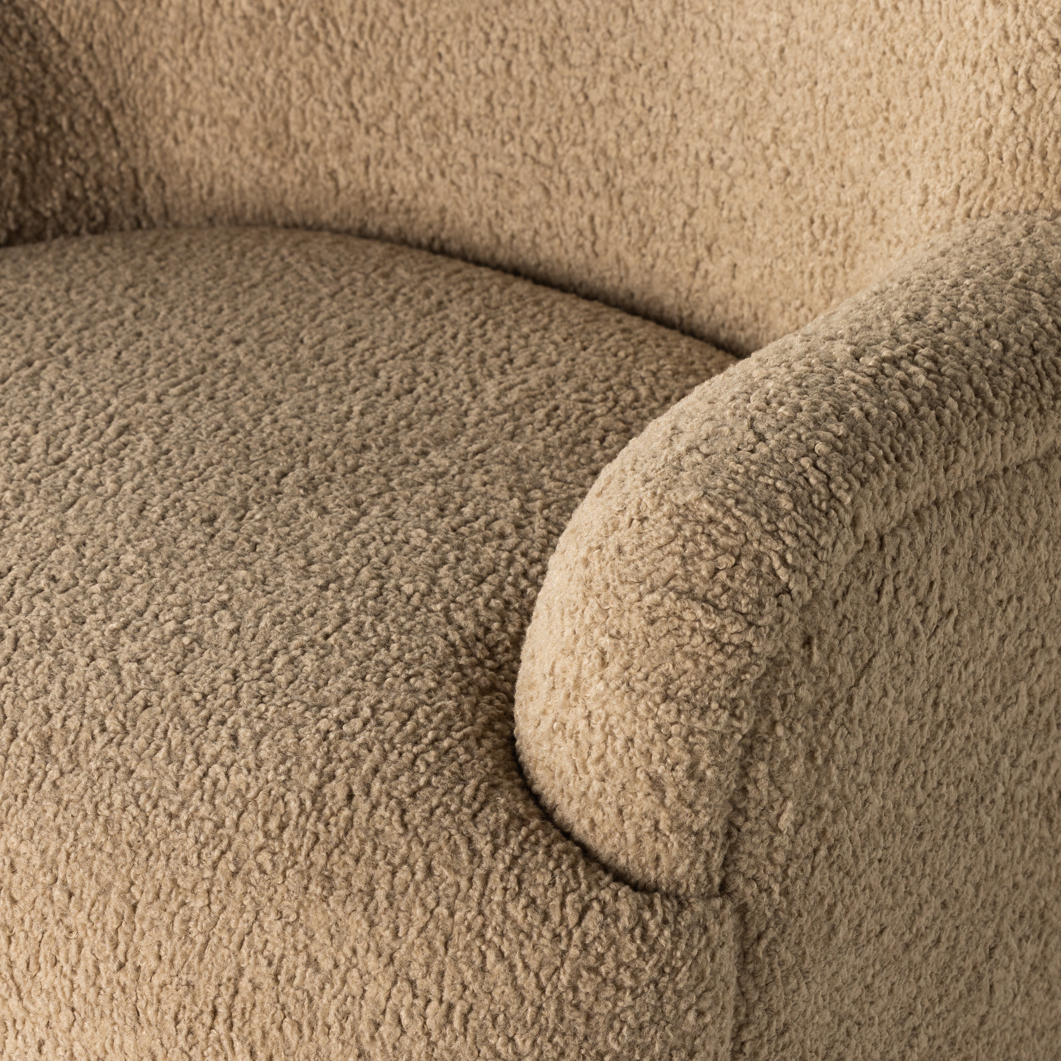 Simply classic. The Kadon Swivel Chair features a high wing back and pairs with softly rolled arms for a curvy look and supportive sit. Camel-colored shearling-upholstered seating tops a 360-degree swivel for total modernity. Amethyst Home provides interior design, new home construction design consulting, vintage area rugs, and lighting in the Newport Beach metro area.