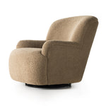 Simply classic. The Kadon Swivel Chair features a high wing back and pairs with softly rolled arms for a curvy look and supportive sit. Camel-colored shearling-upholstered seating tops a 360-degree swivel for total modernity. Amethyst Home provides interior design, new home construction design consulting, vintage area rugs, and lighting in the Charlotte metro area.