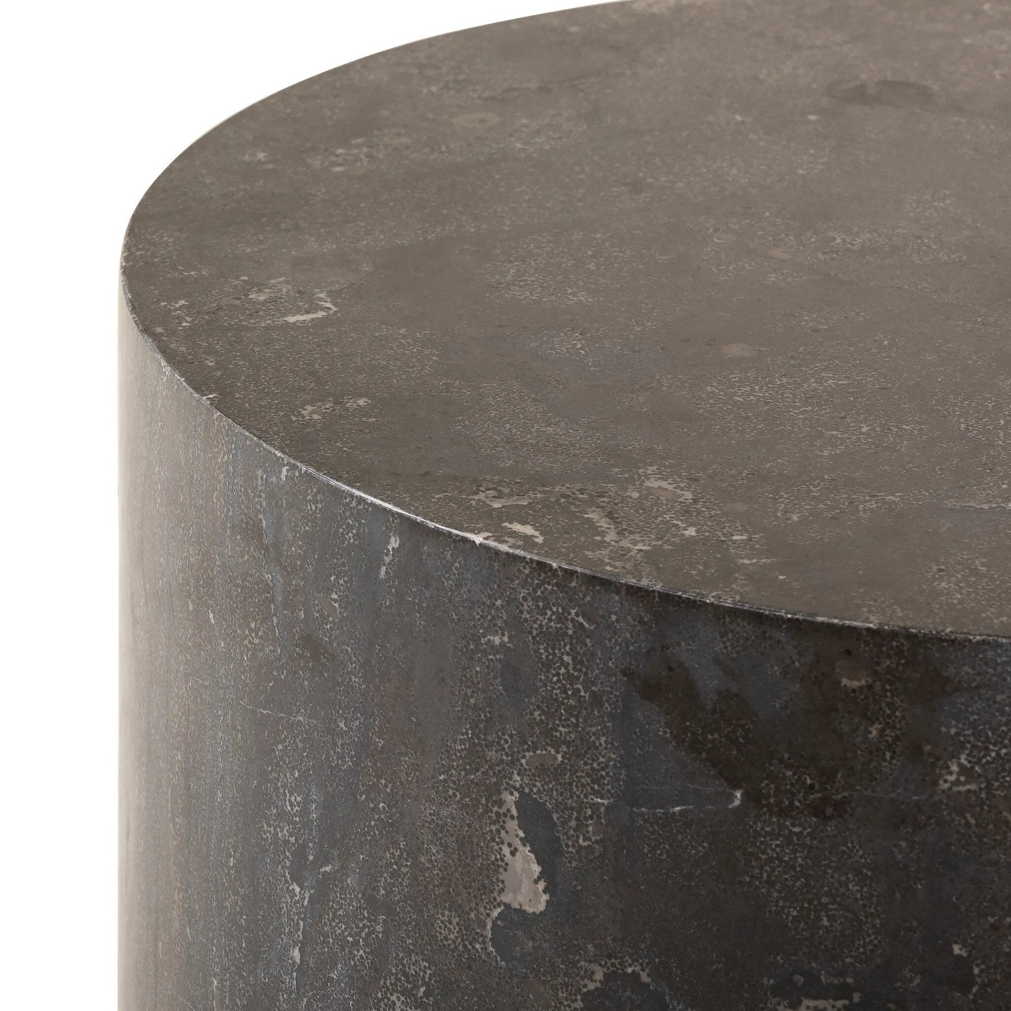 A cylinder-shaped end tables brings an organic look to the living room. Made from natural polished bluestone.Collection: Hughe Amethyst Home provides interior design, new home construction design consulting, vintage area rugs, and lighting in the Portland metro area.