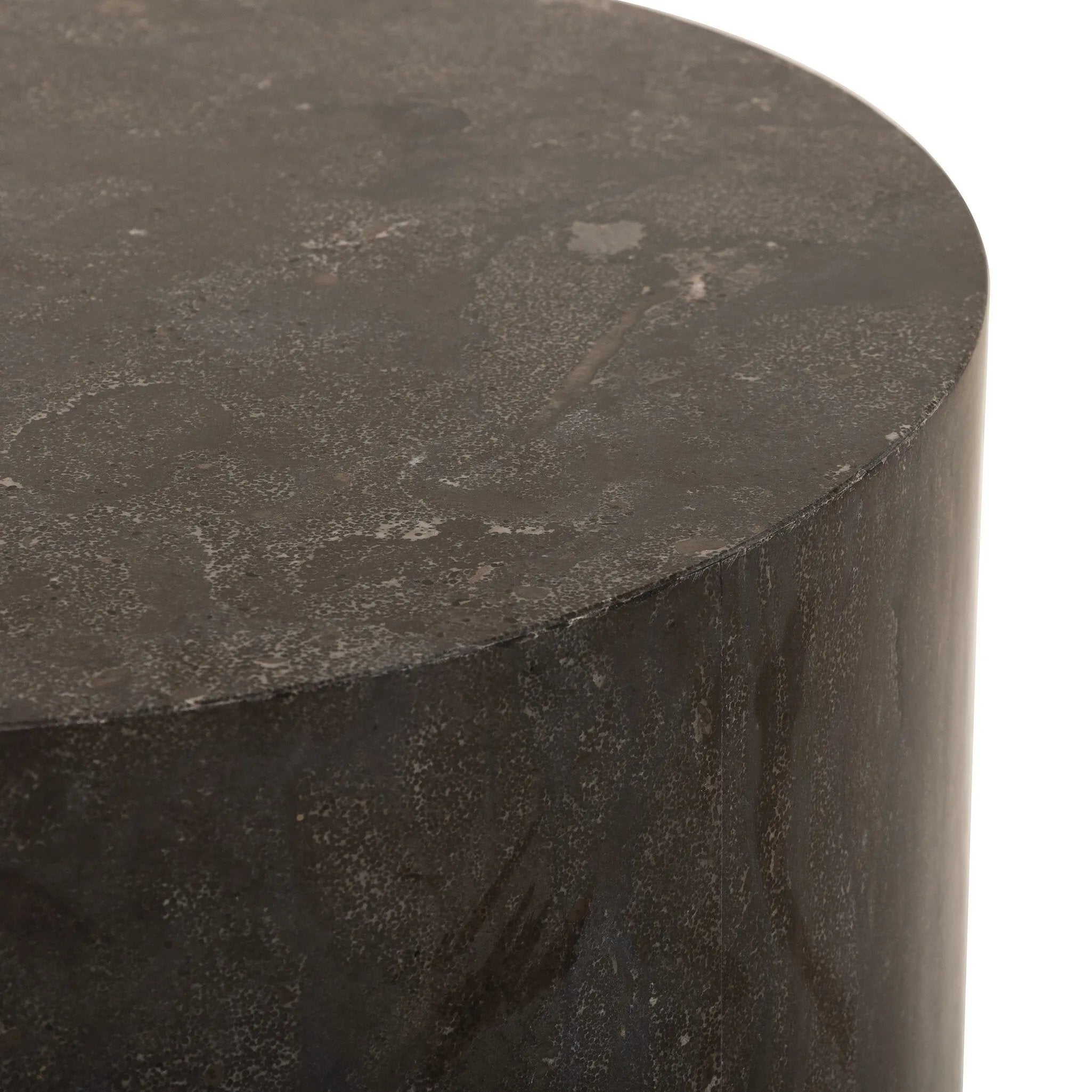 A cylinder-shaped end tables brings an organic look to the living room. Made from natural polished bluestone.Collection: Hughe Amethyst Home provides interior design, new home construction design consulting, vintage area rugs, and lighting in the Tampa metro area.