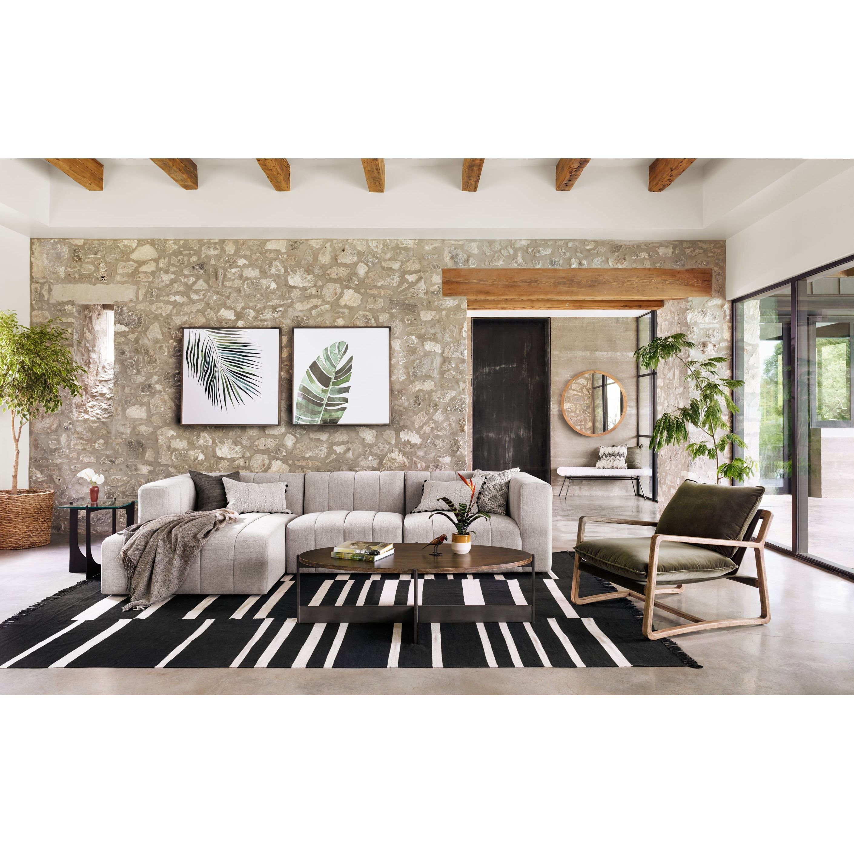Wide, vertical channels and low styling speaks to modish Italian influence. Sandstone-colored covering and modular components allow for versatility in any space. Left arm facing chaise to matching sectional. Amethyst Home provides interior design, new home construction design consulting, vintage area rugs, and lighting in the Houston metro area.