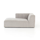 Wide, vertical channels and low styling speaks to modish Italian influence. Sandstone-colored covering and modular components allow for versatility in any space. Left arm facing chaise to matching sectional. Amethyst Home provides interior design, new home construction design consulting, vintage area rugs, and lighting in the Laguna Beach metro area.