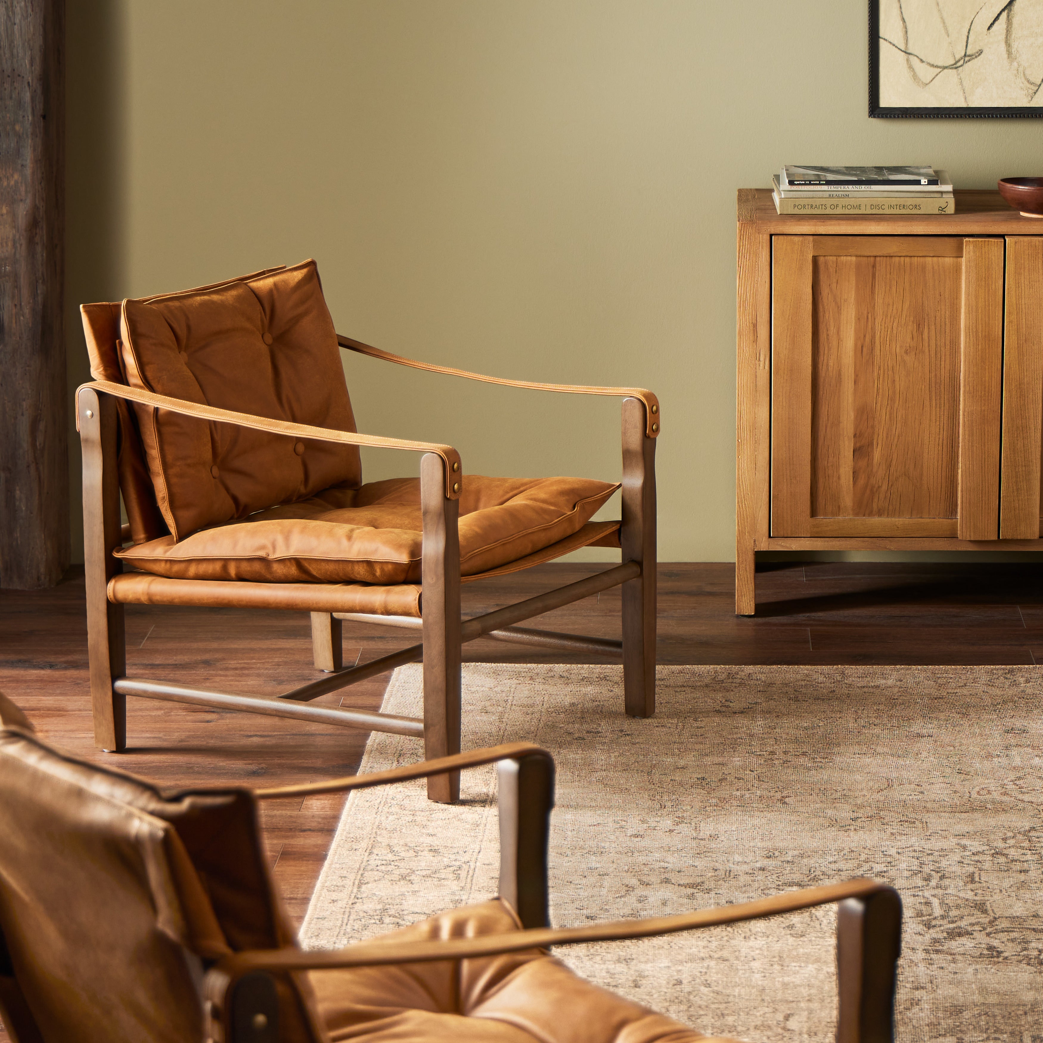 This material-driven take on safari styling features cognac-hued Italian-designed leather that's been lightly sanded and buffed by hand for a suede-like feel. With a tufted sling-style seat, strap arm and pivot back, this vintage-feeling accent chair makes a chic statement wherever it's styled. Amethyst Home provides interior design, new construction, custom furniture, and area rugs in the Alpharetta metro area.