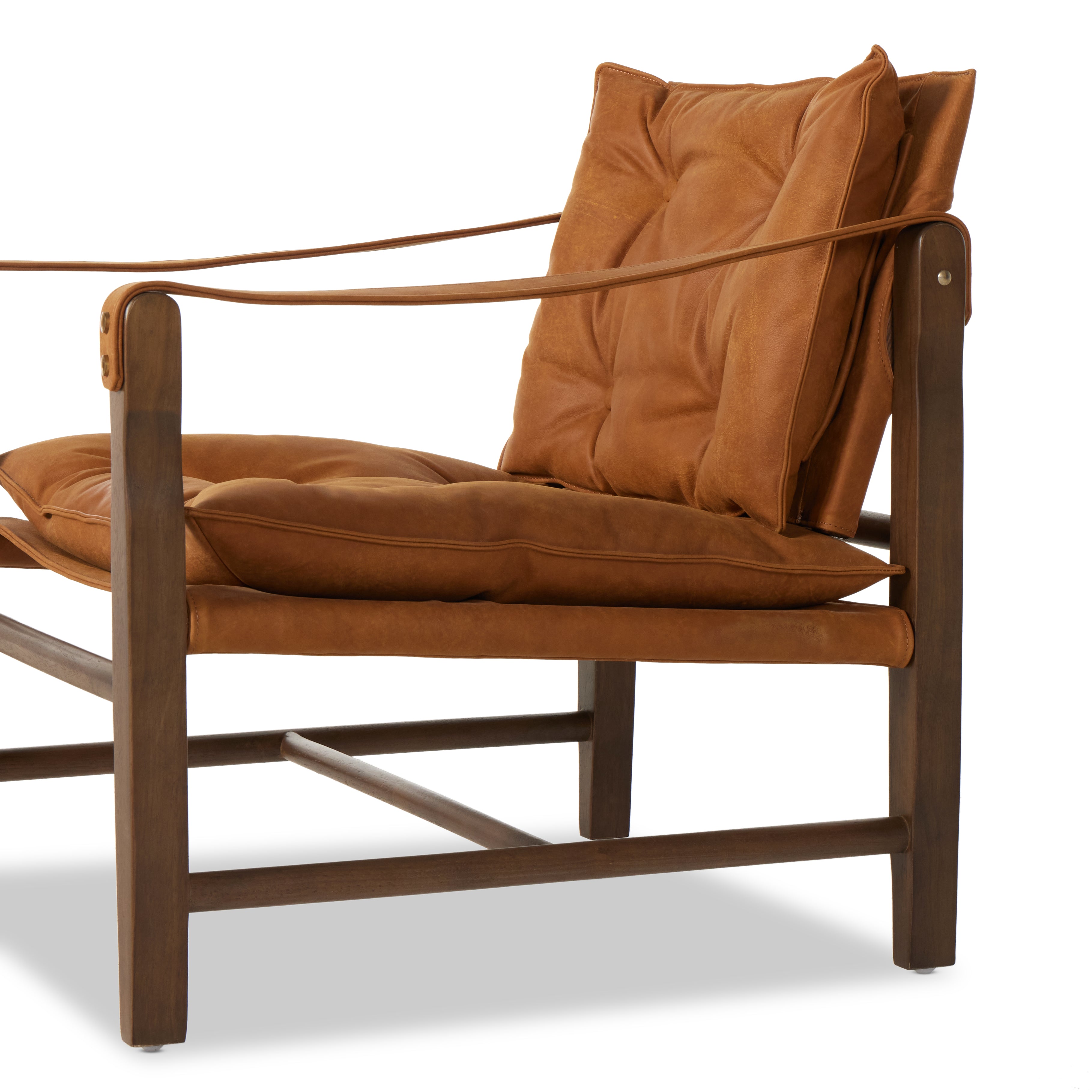 Featuring Lenz Kennison Cognac Chair by Four Hands at Amethyst Home. This material-driven take on safari styling features cognac-hued Italian-designed leather that's been lightly sanded and buffed by hand for a suede-like feel. With a tufted sling-style seat, strap arm and pivot back, this vintage-feeling accent chair makes a chic statement wherever it's styled.
Collection: Westg. Amethyst Home provides interior design, new construction, custom furniture, and area rugs in the Nashville metro area.