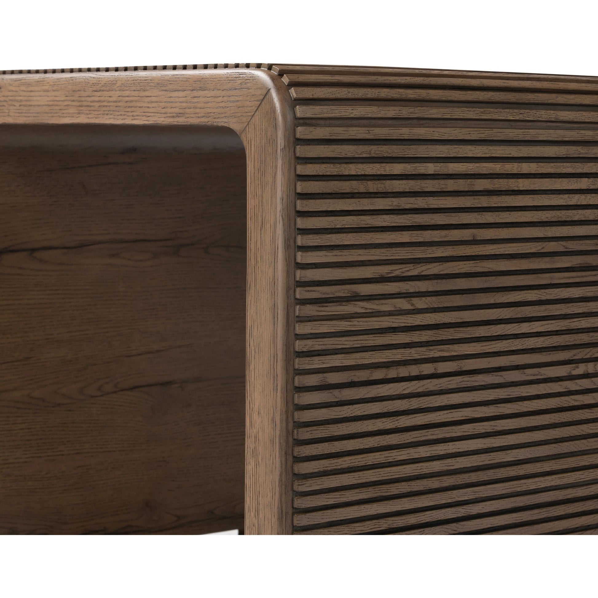 Made from rustic-finished oak, linear reeding and a curved shape define this midcentury-spirited end table. Designed in partnership with longtime Four Hands collaborator Thomas Bina and Brazilian designer Ronald Sasson.Collection: Bin Amethyst Home provides interior design, new home construction design consulting, vintage area rugs, and lighting in the Charlotte metro area.