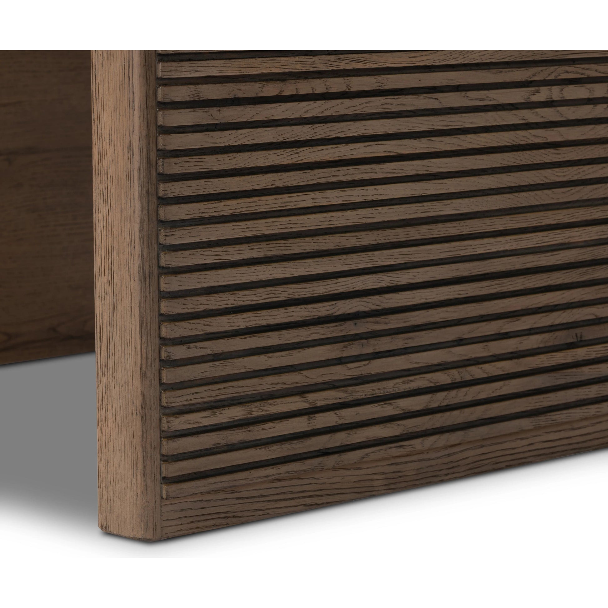 Made from rustic-finished oak, linear reeding and a curved shape define this midcentury-spirited end table. Designed in partnership with longtime Four Hands collaborator Thomas Bina and Brazilian designer Ronald Sasson.Collection: Bin Amethyst Home provides interior design, new home construction design consulting, vintage area rugs, and lighting in the Monterey metro area.
