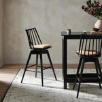 Featuring Lewis Black Counter Swivel Stool with Cushion by Four Hands at Amethyst Home. A new take on the traditional Windsor. This tall beauty is wire-brushed to highlight the cathedral grain of black oak. Perfectly sized for the counter, with a swivel for ease and a top-grain leather cushion for comfort.Overall Dimensions: 21.75"W x 21"L x 42"H
Collection: W. Amethyst Home provides interior design, new home construction design consulting, vintage area rugs, and lighting in the Austin metro area.