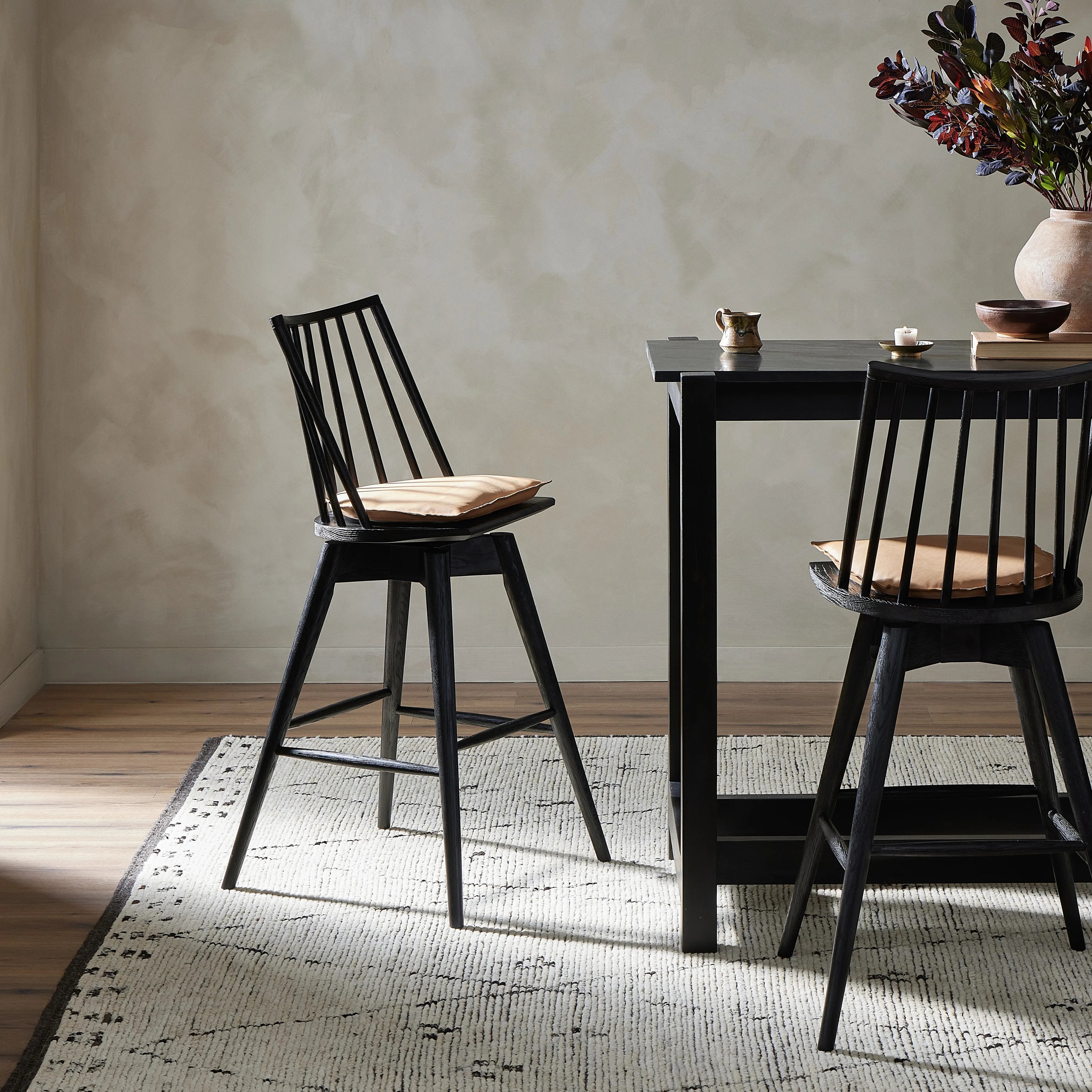 Featuring Lewis Black Counter Swivel Stool with Cushion by Four Hands at Amethyst Home. A new take on the traditional Windsor. This tall beauty is wire-brushed to highlight the cathedral grain of black oak. Perfectly sized for the counter, with a swivel for ease and a top-grain leather cushion for comfort.Overall Dimensions: 21.75"W x 21"L x 42"H
Collecti. Amethyst Home provides interior design, new home construction design consulting, vintage area rugs, and lighting in the Los Angeles metro area.