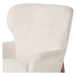 The classic wingback chair is updated with a midcentury-style base. Flared arms and a high winged back with blind tufting offer all-around comfort. Upholstered in a heavily textured boucle performance fabric bringing movement and everyday function to the piece. Amethyst Home provides interior design, new construction, custom furniture, and area rugs in the Portland metro area.
