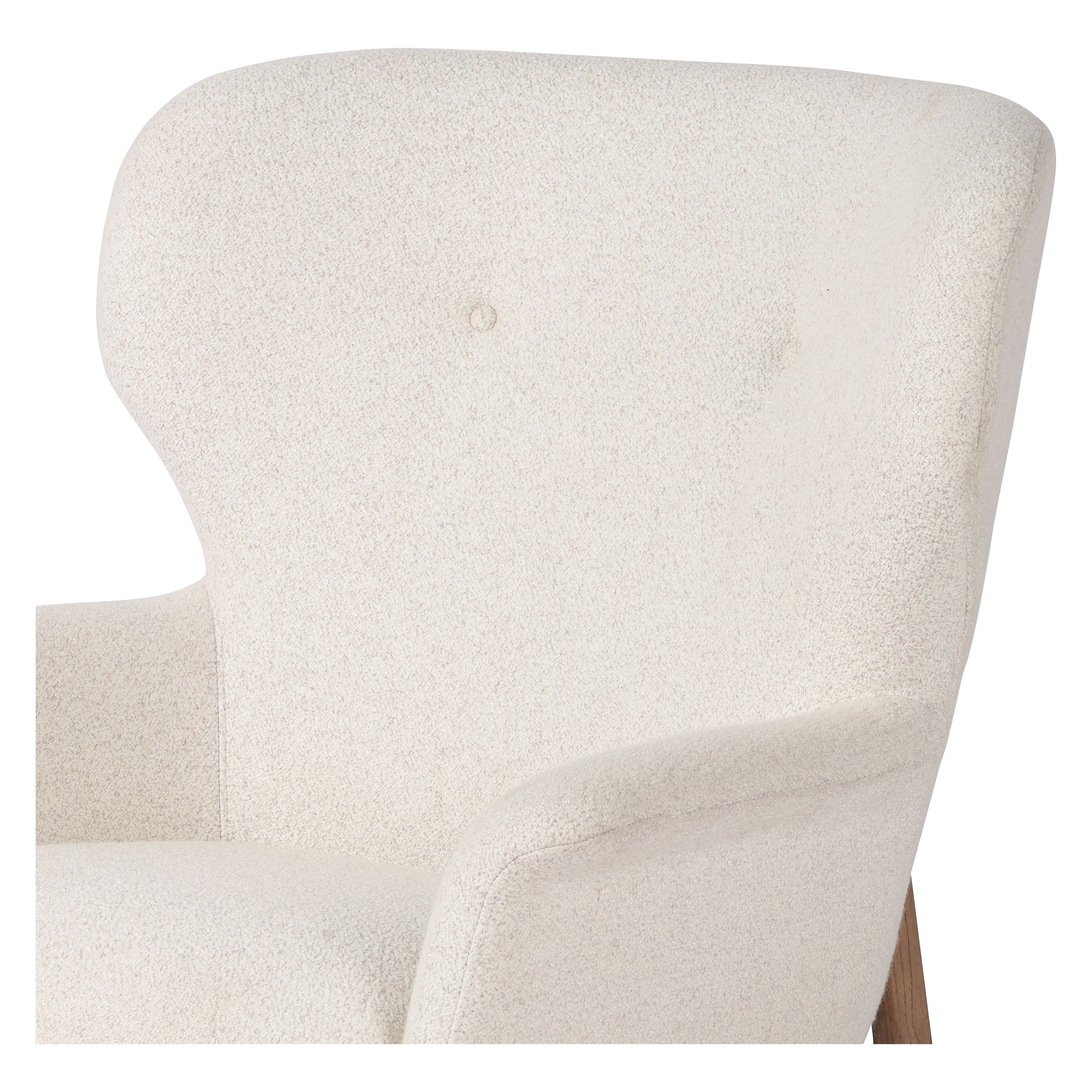 The classic wingback chair is updated with a midcentury-style base. Flared arms and a high winged back with blind tufting offer all-around comfort. Upholstered in a heavily textured boucle performance fabric bringing movement and everyday function to the piece. Amethyst Home provides interior design, new construction, custom furniture, and area rugs in the Portland metro area.