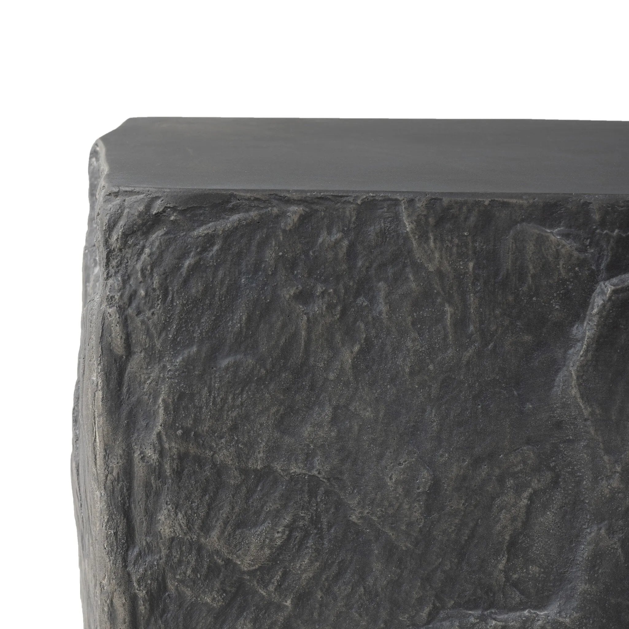 Cast black concrete features heavily textured sides that resemble natural slate, paired with a smoothed tabletop.Collection: Chandle Amethyst Home provides interior design, new home construction design consulting, vintage area rugs, and lighting in the Omaha metro area.