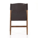 Featuring Lulu Espresso Leather Armless Dining Chair by Four Hands at Amethyst Home. Sleek, streamlined seating with a midcentury vibe. Lulu Espresso Leather Armless Dining Chair features a sling leather seatback and a faux shearling seat in liquid-repellent performance fabric. Frame and legs made of solid ash wood. Performance fabrics are specially created to withstand spills, stains, hi. Amethyst Home provides interior design services, furniture, rugs, and lighting in the Kansas City metro area.