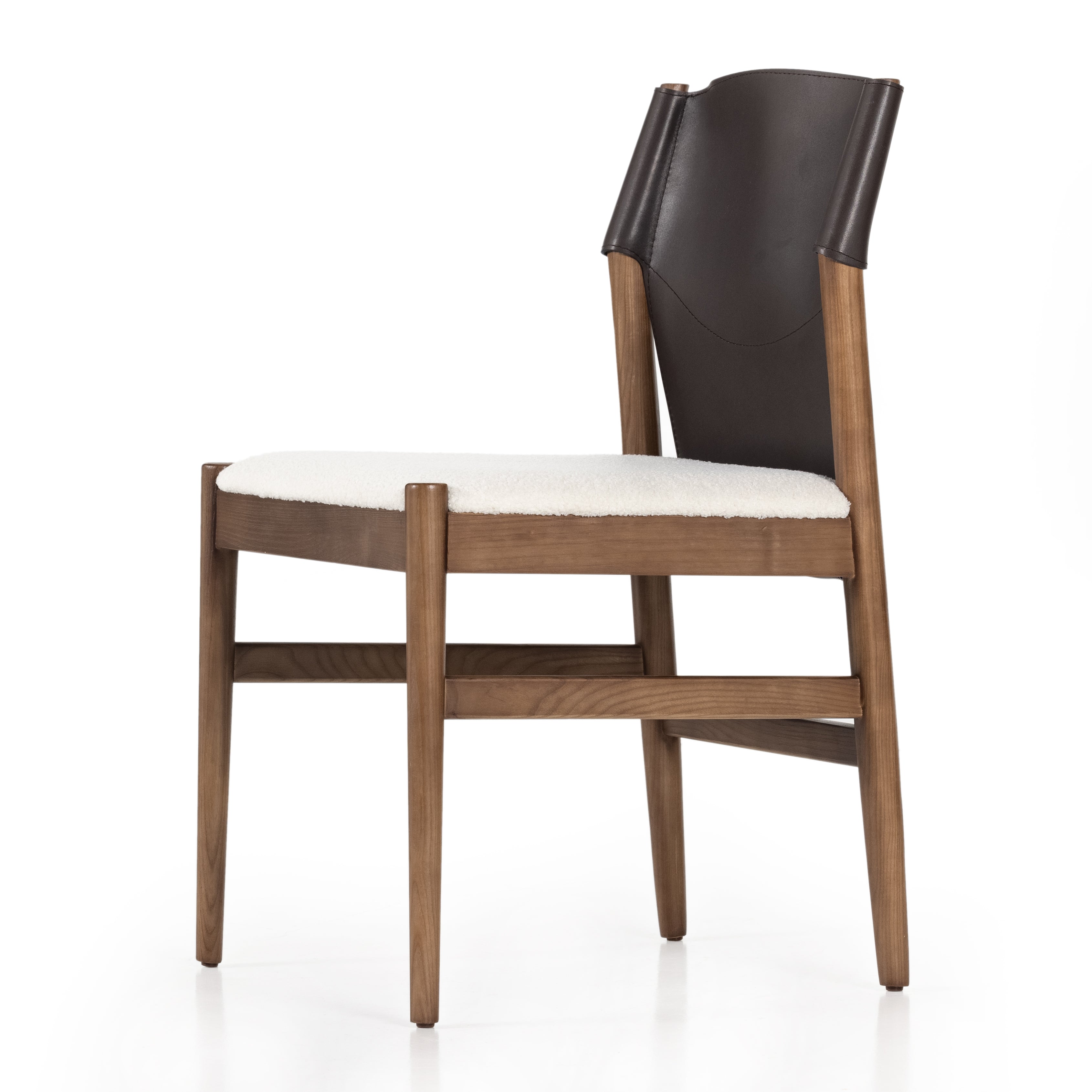 Featuring Lulu Espresso Leather Armless Dining Chair by Four Hands at Amethyst Home. Sleek, streamlined seating with a midcentury vibe. Lulu Espresso Leather Armless Dining Chair features a sling leather seatback and a faux shearling seat in liquid-repellent performance fabric. Frame and legs made of solid ash wood. Performance fabrics are specially created to withstand spills, stains, high tra. Amethyst Home provides interior design services, furniture, rugs, and lighting in the Omaha metro area.