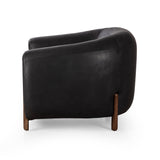 Featuring Lyla Chair - Heirloom Black by Four Hands at Amethyst Home. This updated take on the traditional tub chair pairs rich black top-grain leather with solid ash to shape a sculpted seat with exaggerated depth. Sourced from one of the oldest family-owned tanneries in Italyâ€™s Bassano del Grappa, heirloom leather is salvaged and processed from upcycled hides featuring an ab. Amethyst Home provides interior design, new construction, custom furniture, and area rugs in the Alpharetta metro area.