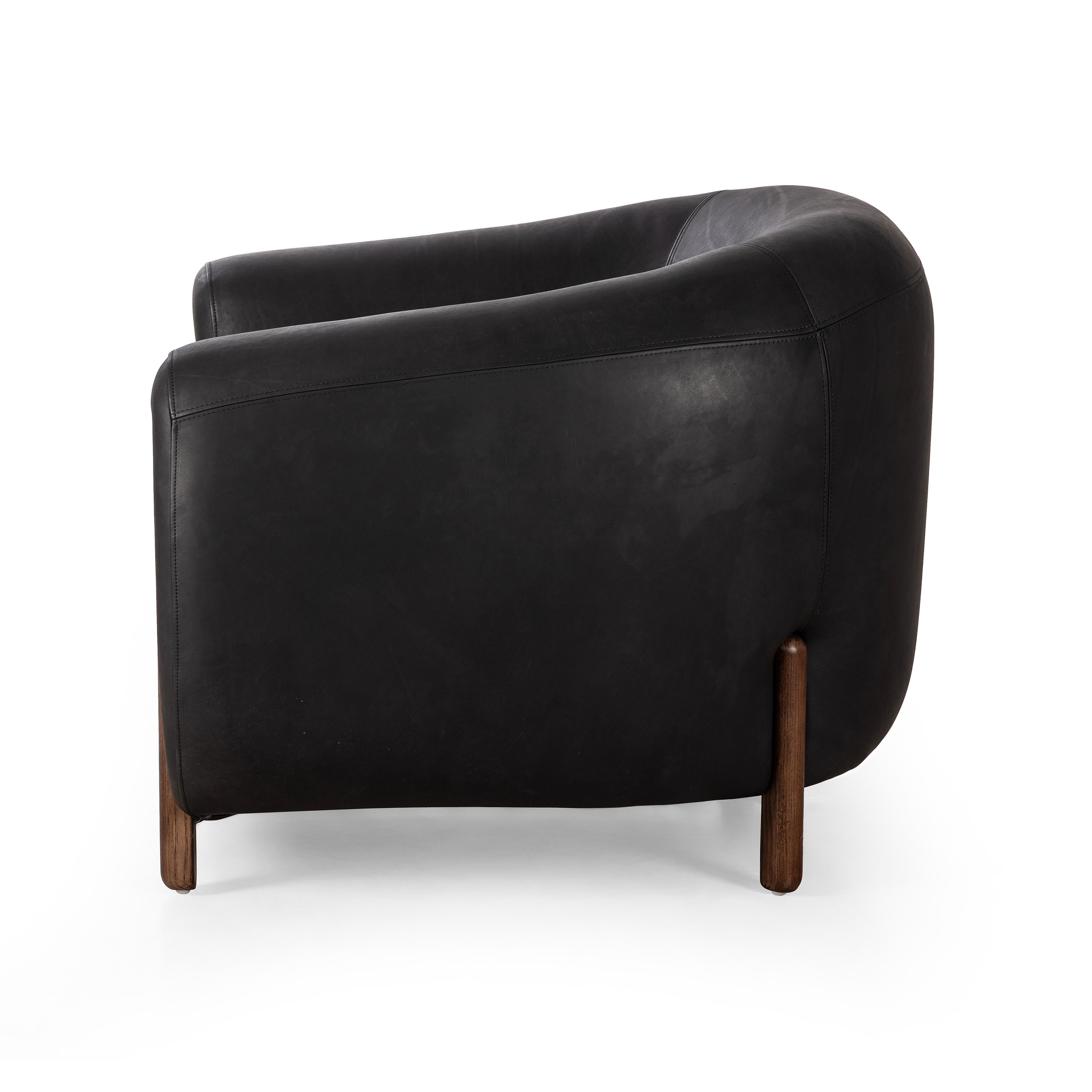 Featuring Lyla Chair - Heirloom Black by Four Hands at Amethyst Home. This updated take on the traditional tub chair pairs rich black top-grain leather with solid ash to shape a sculpted seat with exaggerated depth. Sourced from one of the oldest family-owned tanneries in Italyâ€™s Bassano del Grappa, heirloom leather is salvaged and processed from upcycled hides featuring an ab. Amethyst Home provides interior design, new construction, custom furniture, and area rugs in the Alpharetta metro area.