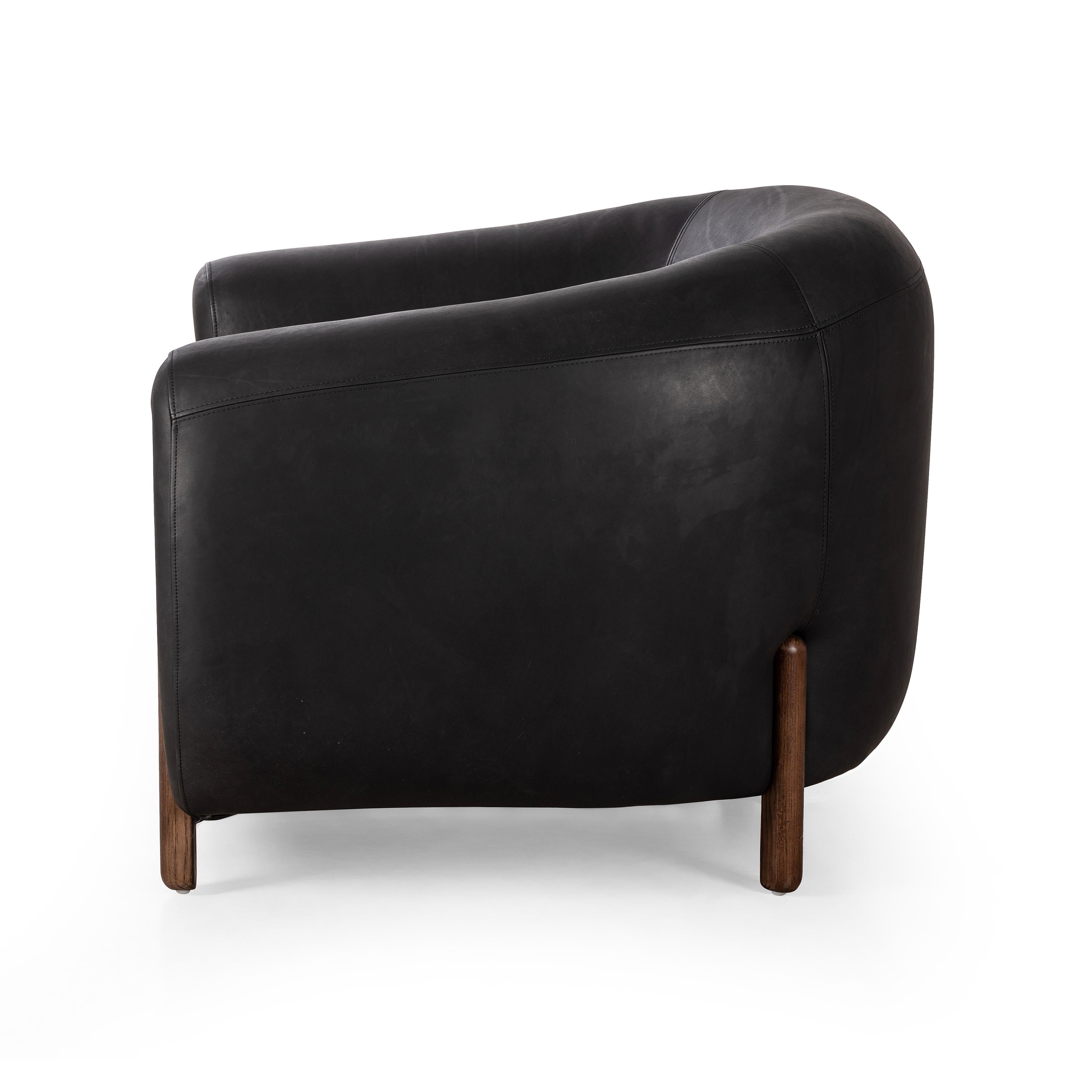 This updated take on the traditional tub chair pairs rich black top-grain leather with solid ash to shape a sculpted seat with exaggerated depth. Sourced from one of the oldest family-owned tanneries in Italyâ€™s Bassano del Grappa, heirloom leather is salvaged and processed from upcycled hides featuring an abundance of natural markings, scars and color variations. Amethyst Home provides interior design, new construction, custom furniture, and area rugs in the Alpharetta metro area.