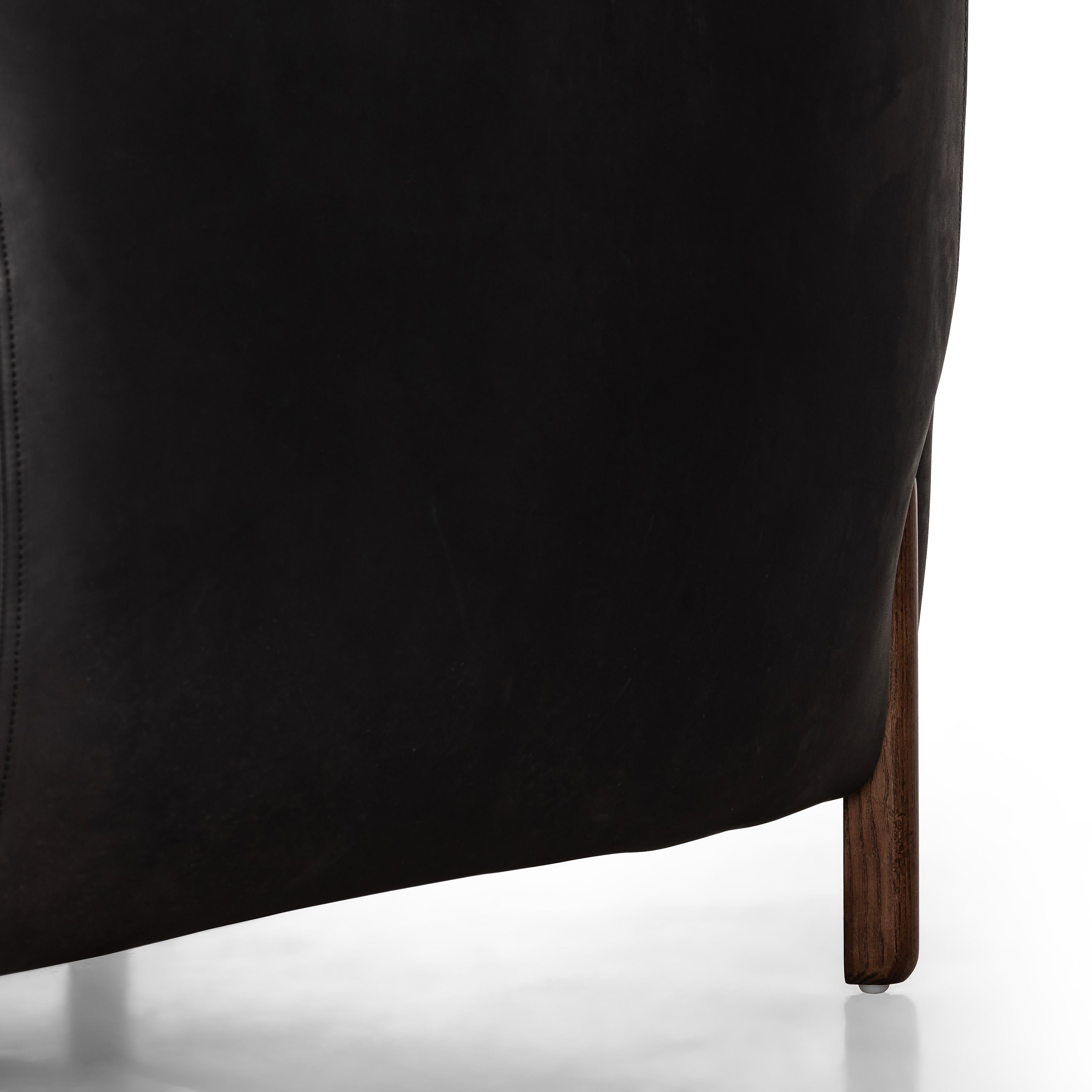 Featuring Lyla Chair - Heirloom Black by Four Hands at Amethyst Home. This updated take on the traditional tub chair pairs rich black top-grain leather with solid ash to shape a sculpted seat with exaggerated depth. Sourced from one of the oldest family-owned tanneries in Italyâ€™s Bassano del Grappa, heirloom leather is salvaged and processed from upcycled hides featuring an abunda. Amethyst Home provides interior design, new construction, custom furniture, and area rugs in the Austin metro area.