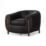 Featuring Lyla Chair - Heirloom Black by Four Hands at Amethyst Home. This updated take on the traditional tub chair pairs rich black top-grain leather with solid ash to shape a sculpted seat with exaggerated depth. Sourced from one of the oldest family-owned tanneries in Italyâ€™s Bassano del Grappa, heirloom leather is salvaged and processed from upcycled hides featuring an abund. Amethyst Home provides interior design, new construction, custom furniture, and area rugs in the Houston metro area.