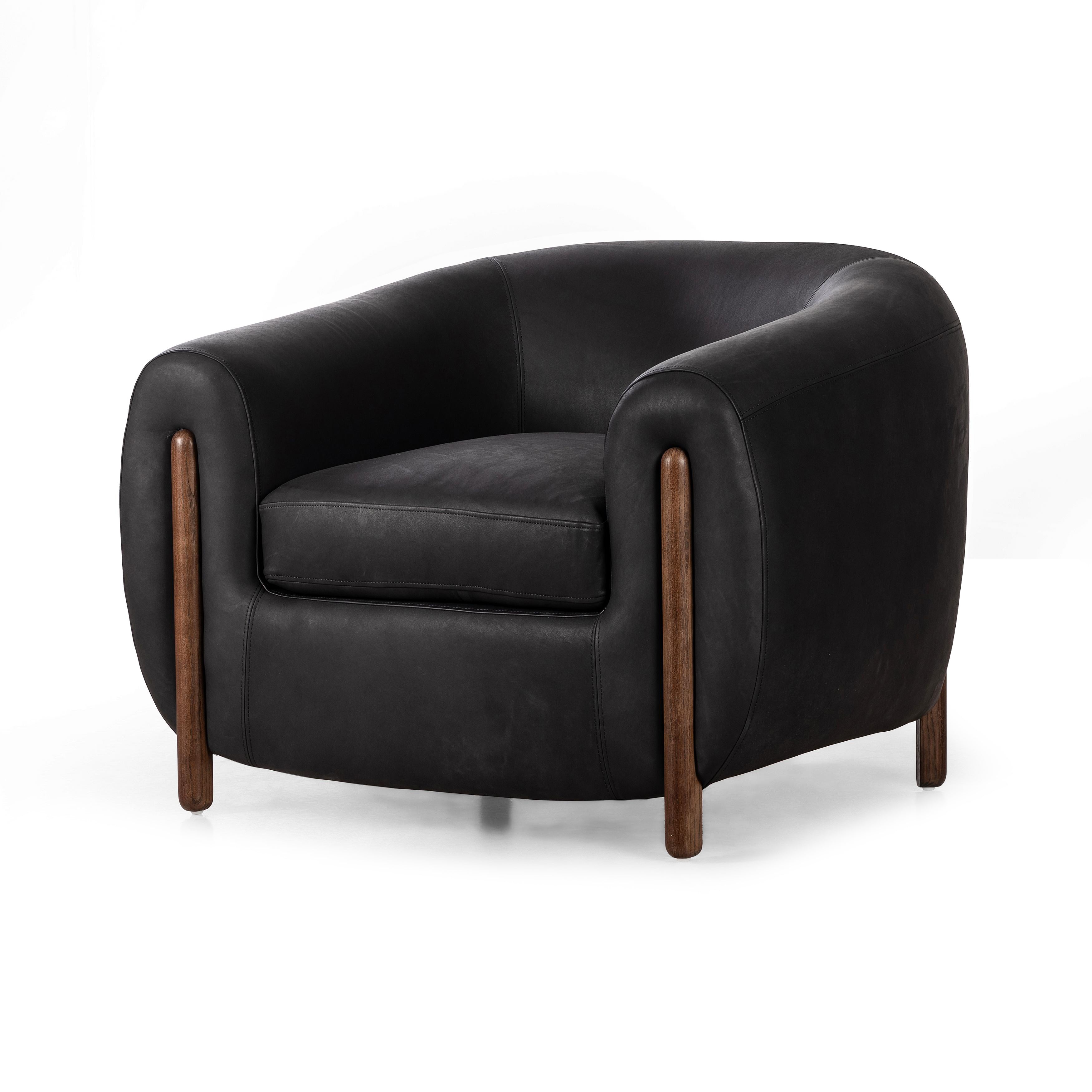 Featuring Lyla Chair - Heirloom Black by Four Hands at Amethyst Home. This updated take on the traditional tub chair pairs rich black top-grain leather with solid ash to shape a sculpted seat with exaggerated depth. Sourced from one of the oldest family-owned tanneries in Italyâ€™s Bassano del Grappa, heirloom leather is salvaged and processed from upcycled hides featuring an abund. Amethyst Home provides interior design, new construction, custom furniture, and area rugs in the Houston metro area.