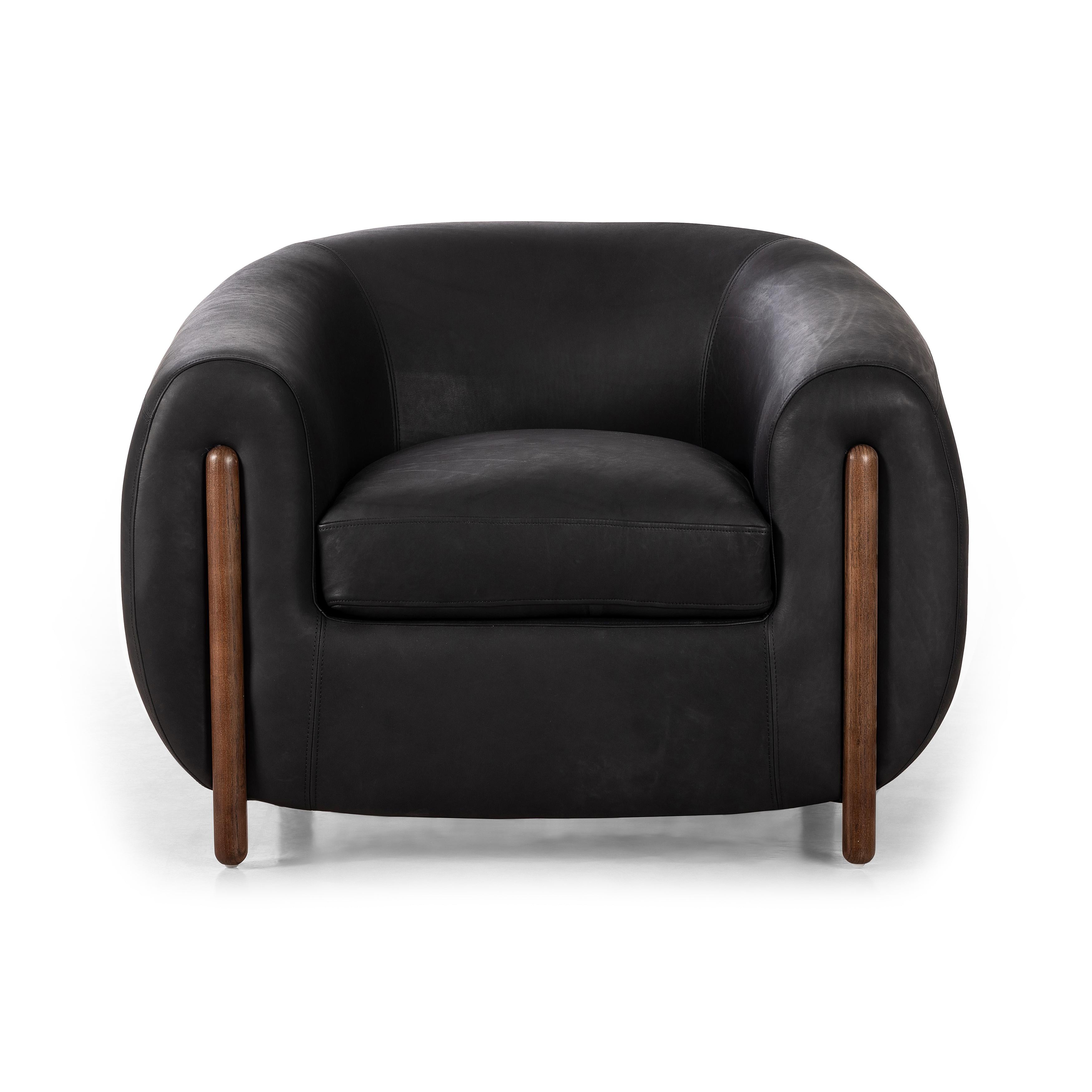 Featuring Lyla Chair - Heirloom Black by Four Hands at Amethyst Home. This updated take on the traditional tub chair pairs rich black top-grain leather with solid ash to shape a sculpted seat with exaggerated depth. Sourced from one of the oldest family-owned tanneries in Italyâ€™s Bassano del Grappa, heirloom leather is salvaged and processed from upcycled hides featuring an abundan. Amethyst Home provides interior design, new construction, custom furniture, and area rugs in the Miami metro area.