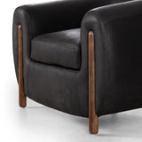 Featuring Lyla Chair - Heirloom Black by Four Hands at Amethyst Home. This updated take on the traditional tub chair pairs rich black top-grain leather with solid ash to shape a sculpted seat with exaggerated depth. Sourced from one of the oldest family-owned tanneries in Italyâ€™s Bassano del Grappa, heirloom leather is salvaged and processed from upcycled hides featuring an abu. Amethyst Home provides interior design, new construction, custom furniture, and area rugs in the San Diego metro area.