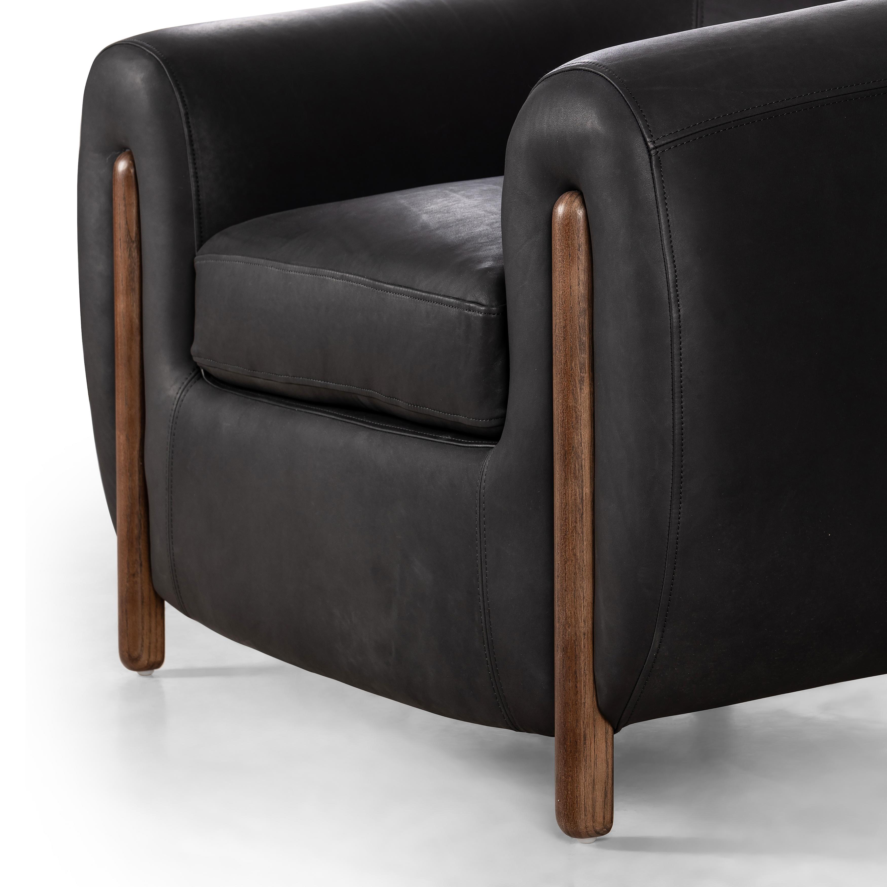 Featuring Lyla Chair - Heirloom Black by Four Hands at Amethyst Home. This updated take on the traditional tub chair pairs rich black top-grain leather with solid ash to shape a sculpted seat with exaggerated depth. Sourced from one of the oldest family-owned tanneries in Italyâ€™s Bassano del Grappa, heirloom leather is salvaged and processed from upcycled hides featuring an abu. Amethyst Home provides interior design, new construction, custom furniture, and area rugs in the San Diego metro area.